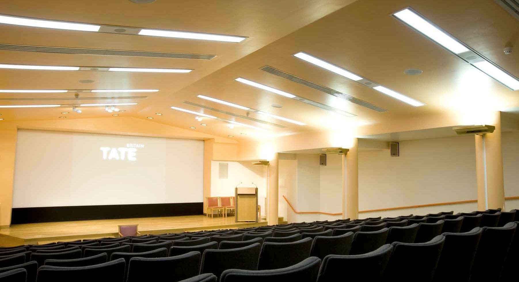 Clore Auditorium at Tate Britain, modern tiered seating for events and presentations.