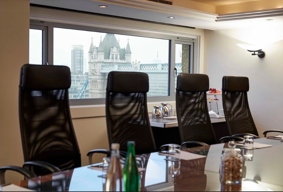 Modern conference room with skyline view, perfect for corporate events and meetings.