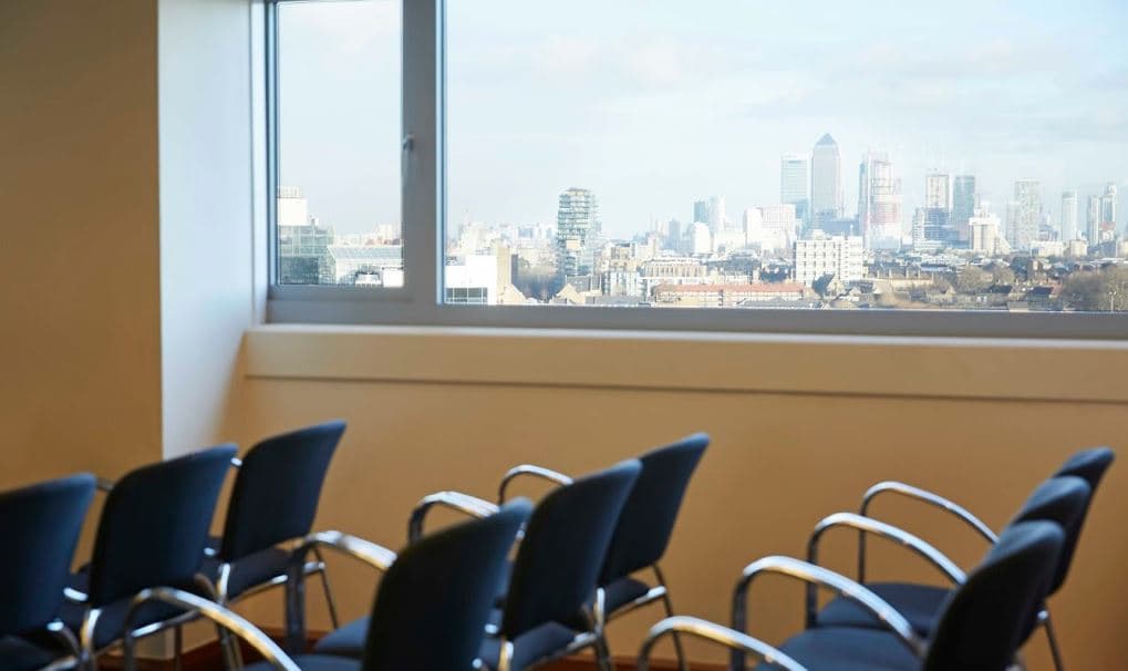 Britannia Suite at The Tower Hotel, modern meeting space with city skyline view.