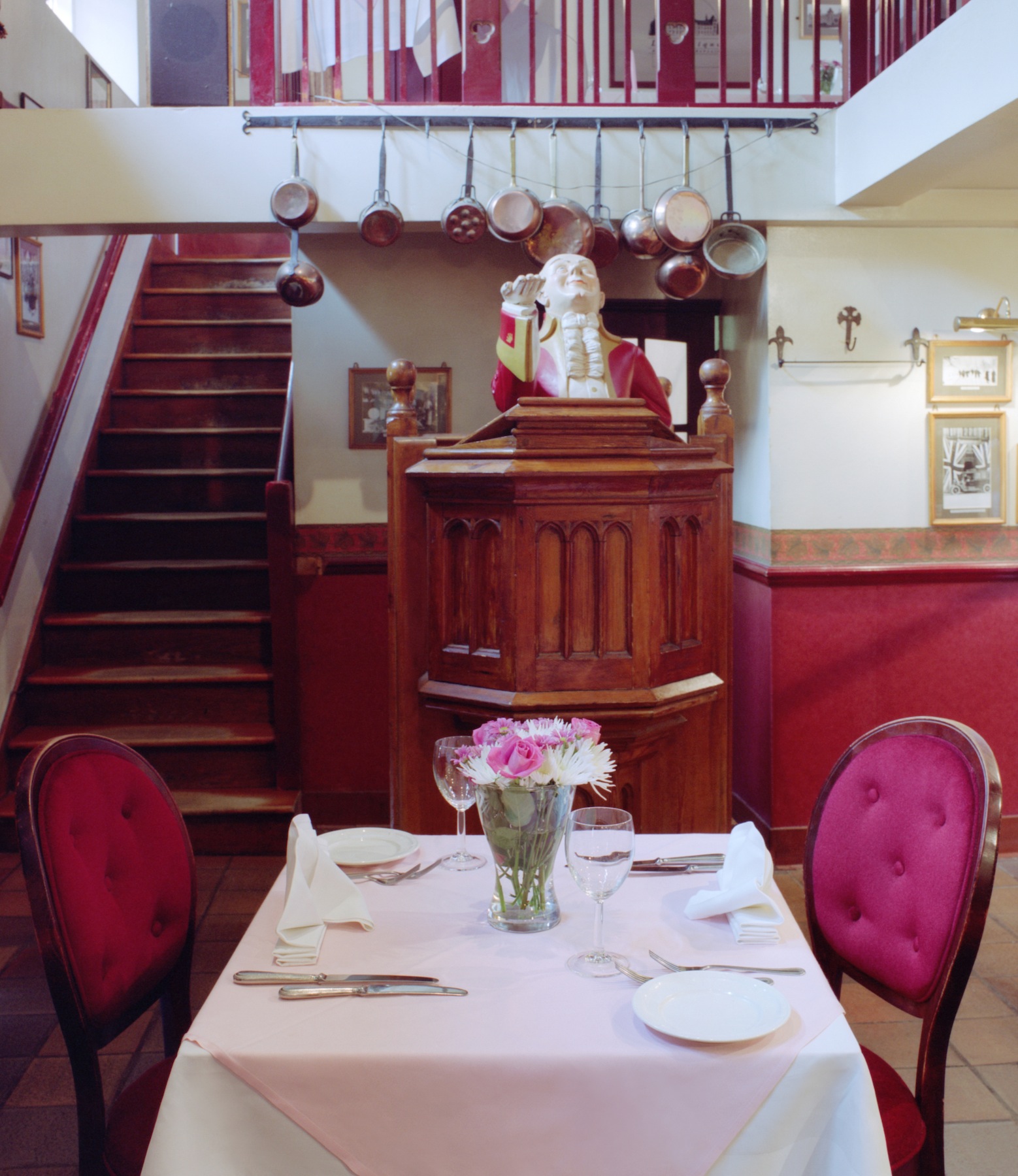 Intimate dining setup in Le Gothique garden for private events and meetings.