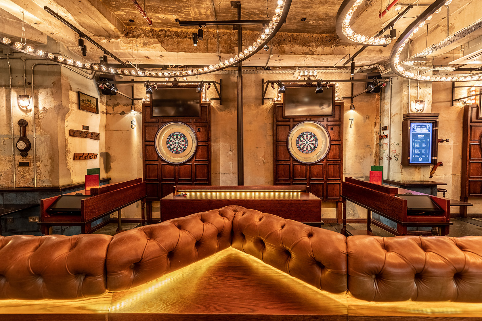 Stylish event space with dartboards in Flight Club Shoreditch for casual gatherings.