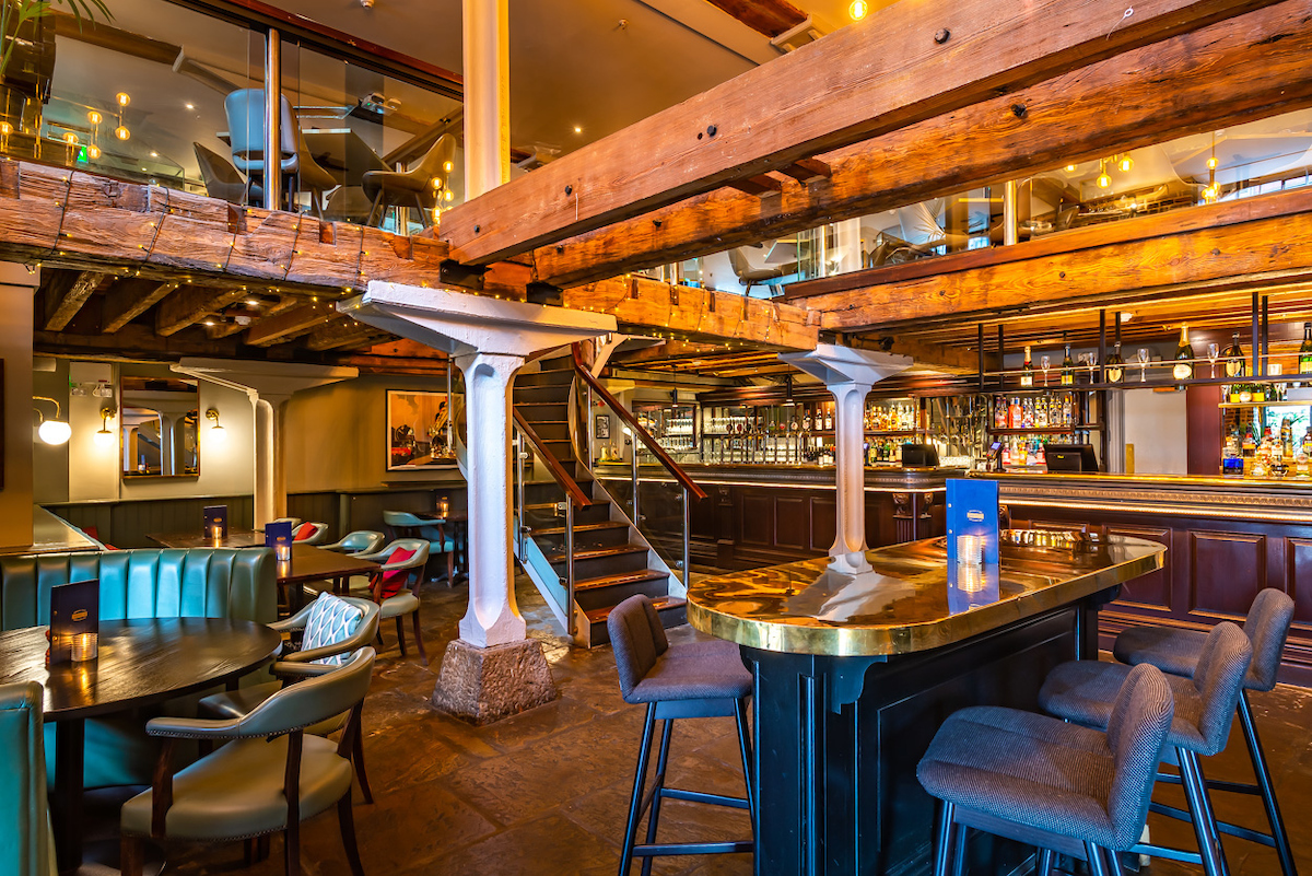 Stylish Cellar Bar with rustic beams, ideal for networking events and casual meetings.