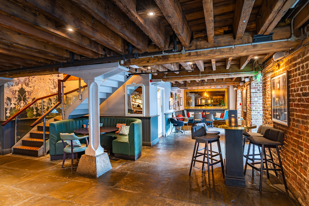 Stylish Cellar Bar with rustic beams, perfect for events and gatherings in West India Quay.