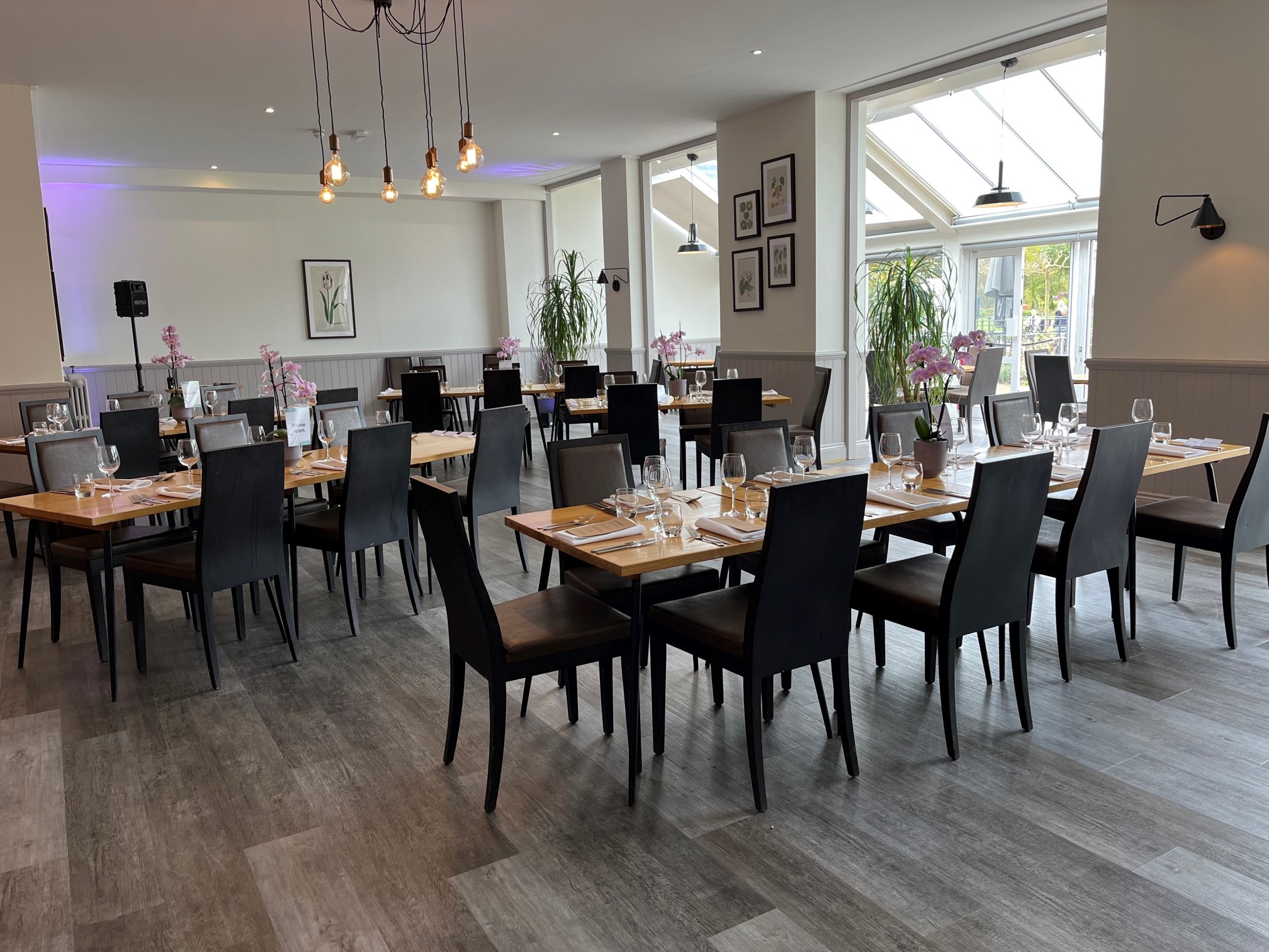 Tulip Tree Room at RHS Garden Wisley, elegant dining space for corporate events and gatherings.