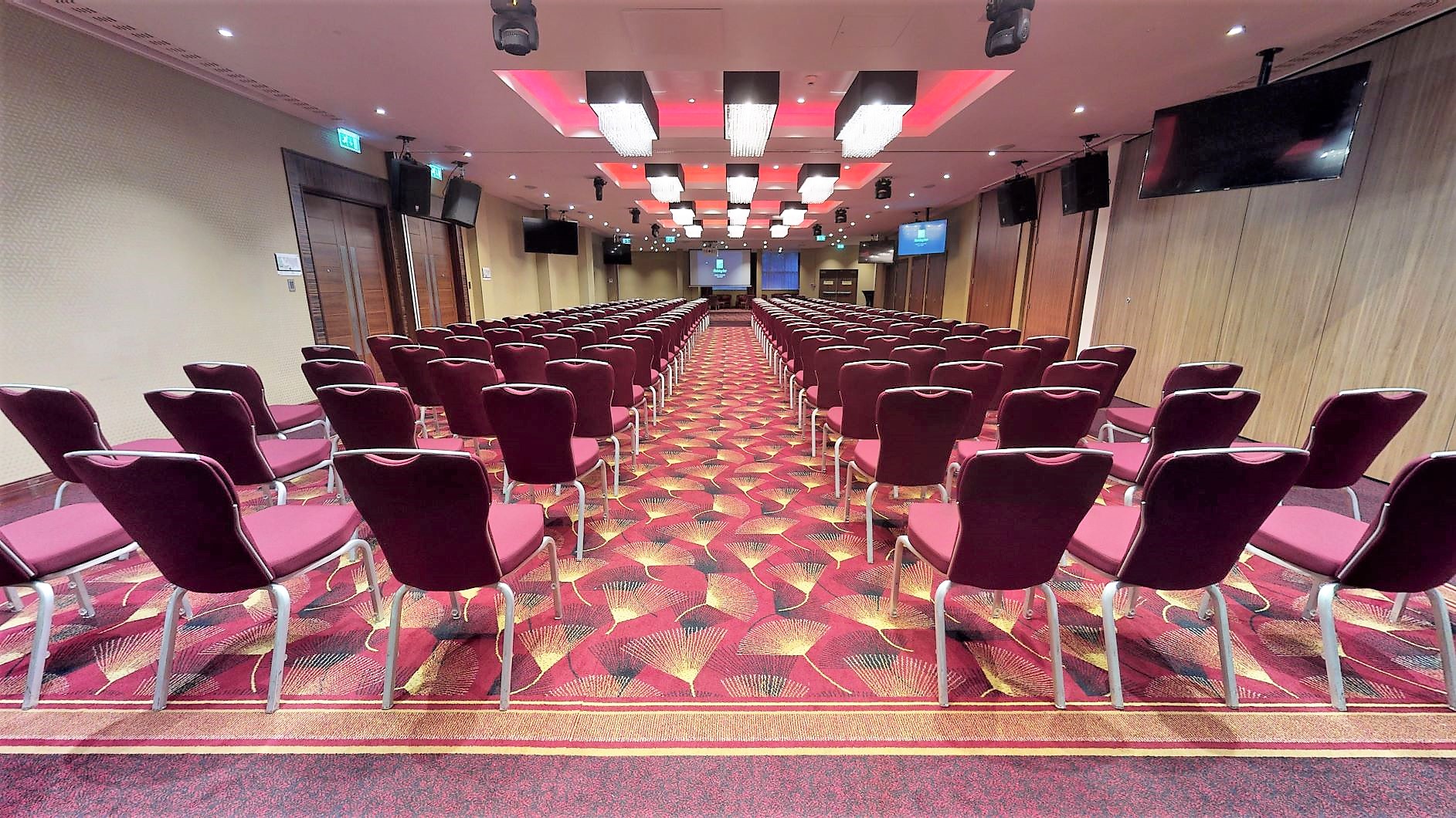 Balmoral Suite conference room with burgundy chairs, ready for presentations and events.