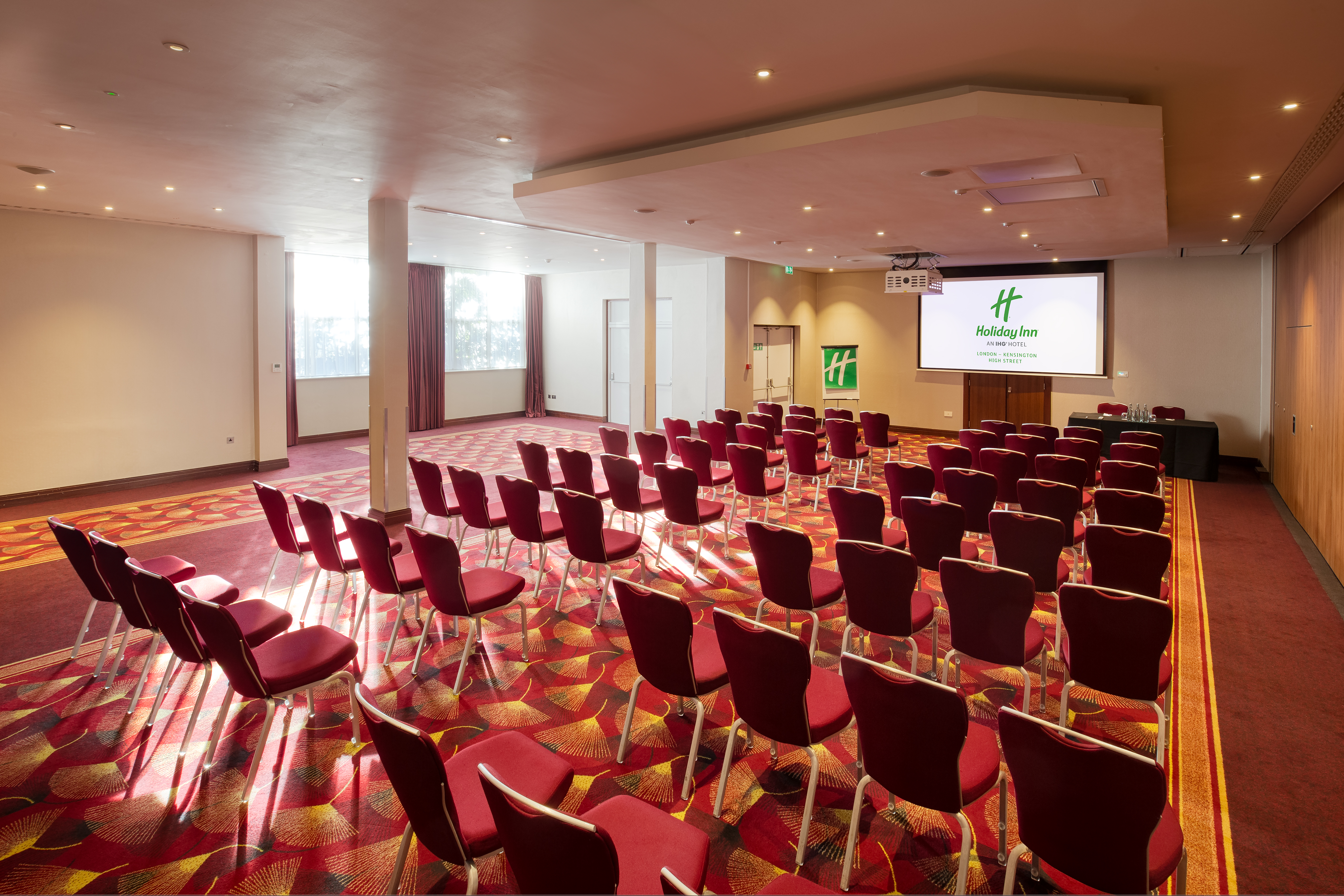 Balmoral Suite at Holiday Inn Kensington: red chairs, ideal for conferences and workshops.