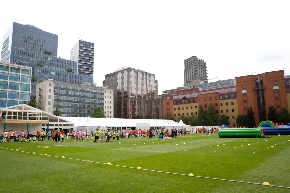 Vibrant outdoor event space with tent for corporate picnics and team-building activities.