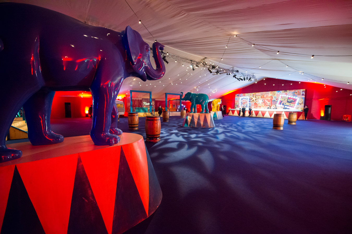 Circus-themed event space with vibrant decor and elephant sculptures at The Artillery Garden.