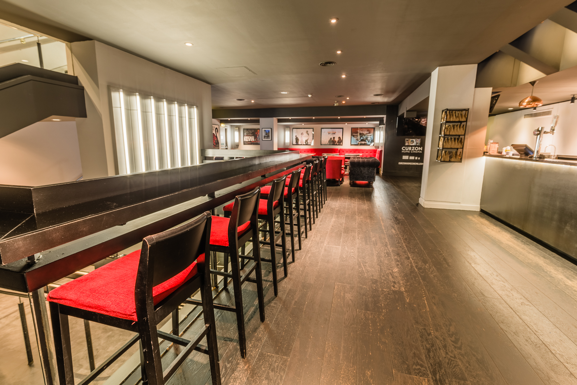 Curzon Soho bar with red stools, ideal for networking events and cocktail receptions.