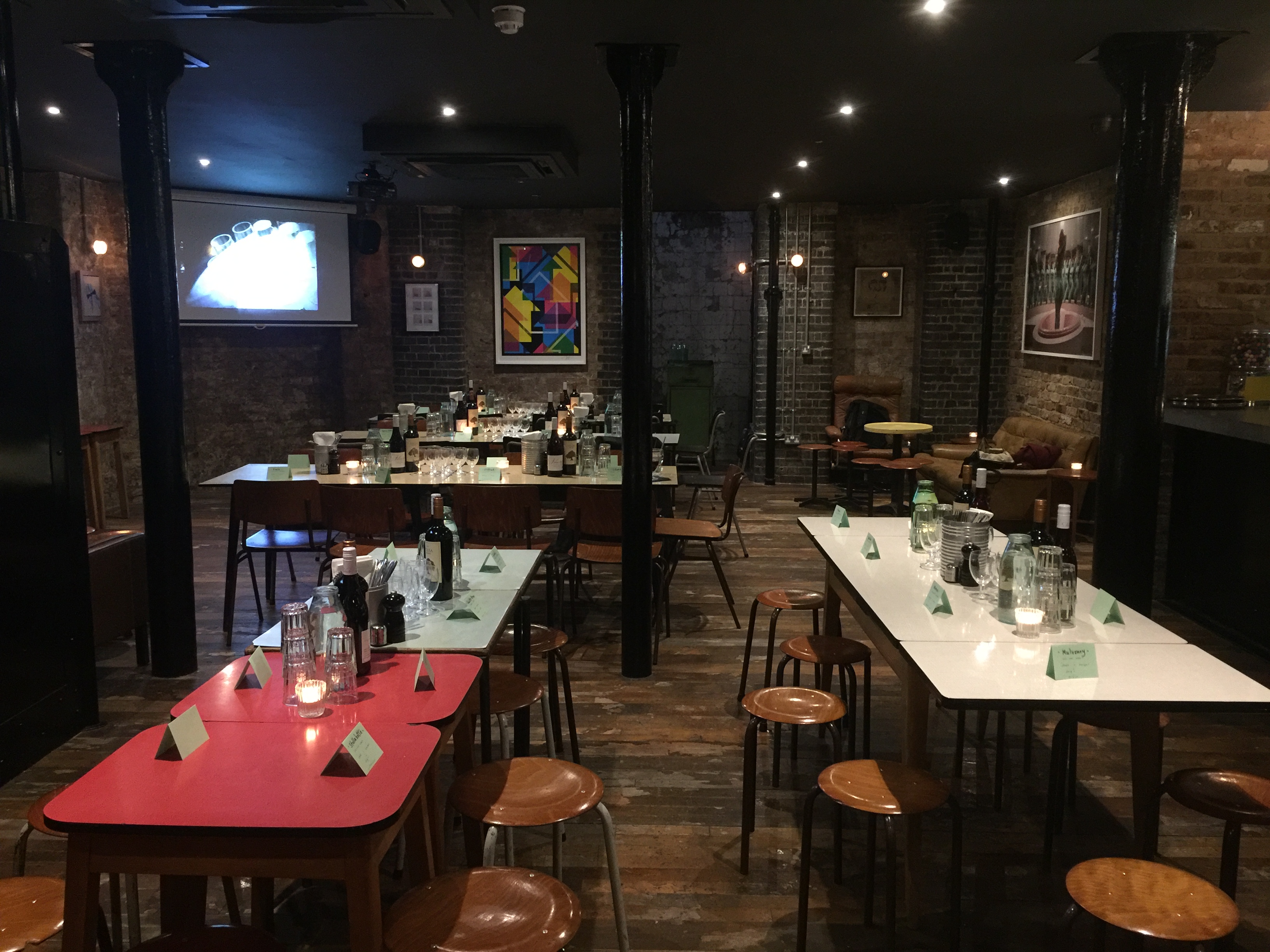 Basement Bar event space with ambient lighting for networking and dining gatherings.