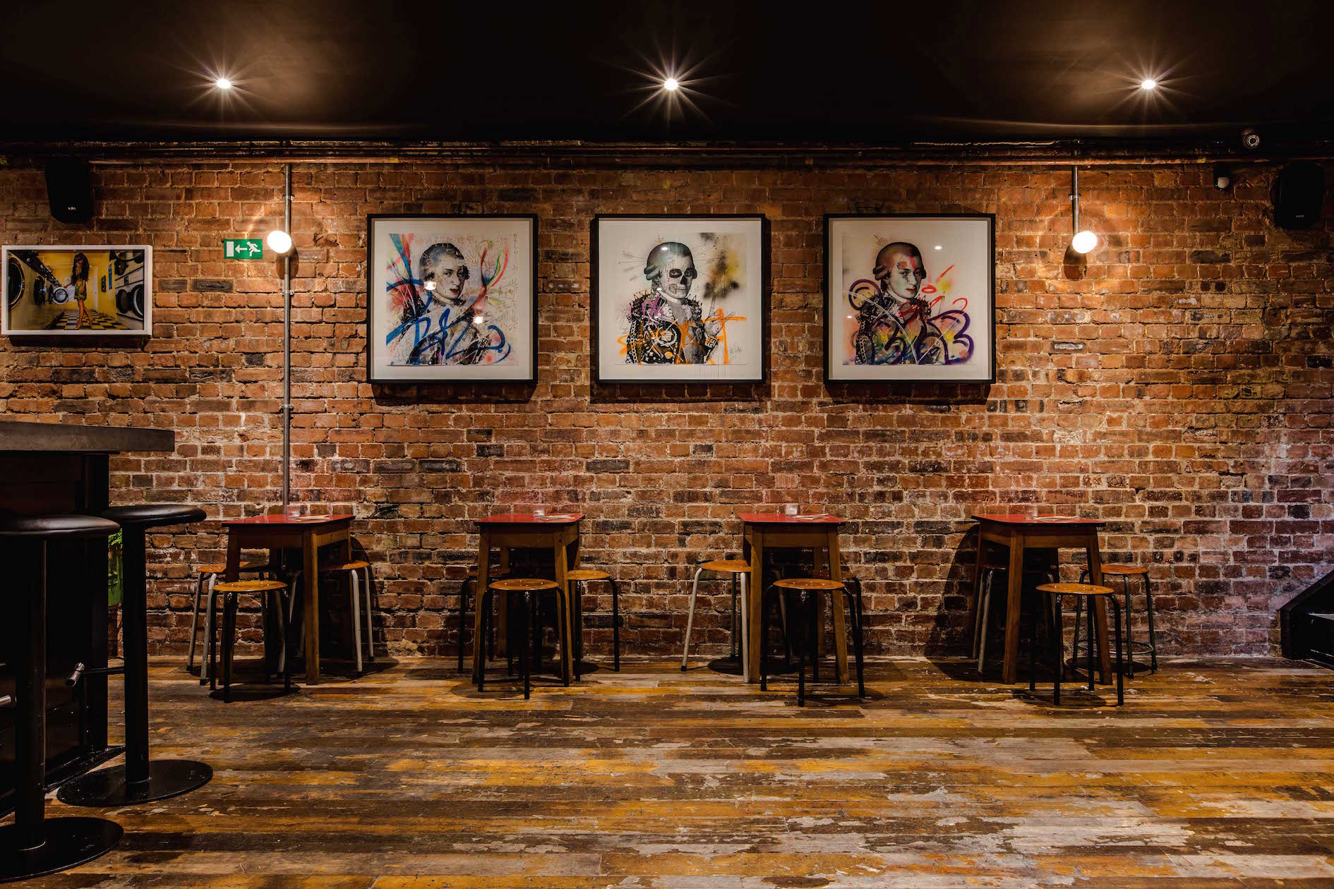 Stylish Basement Bar with exposed brick, perfect for networking events and workshops.