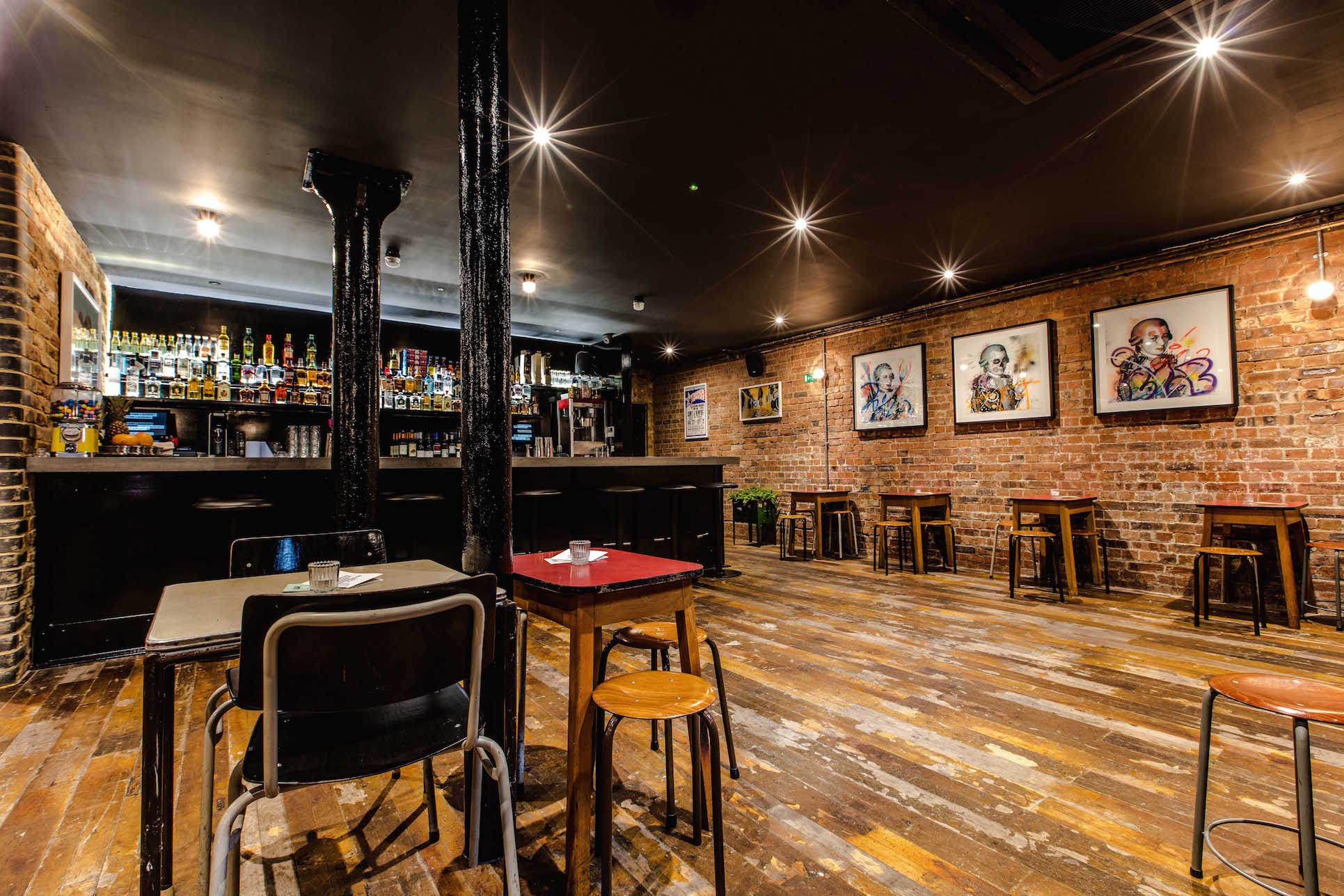 Stylish Basement Bar with exposed brick, perfect for networking events and private gatherings.