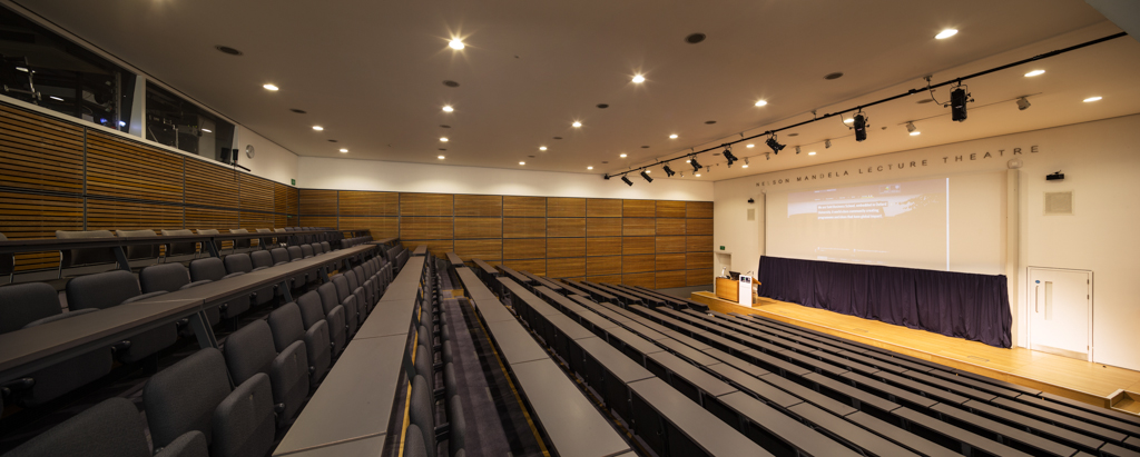 Nelson Mandela Lecture Theatre at Saïd Business School, modern tiered seating for events.