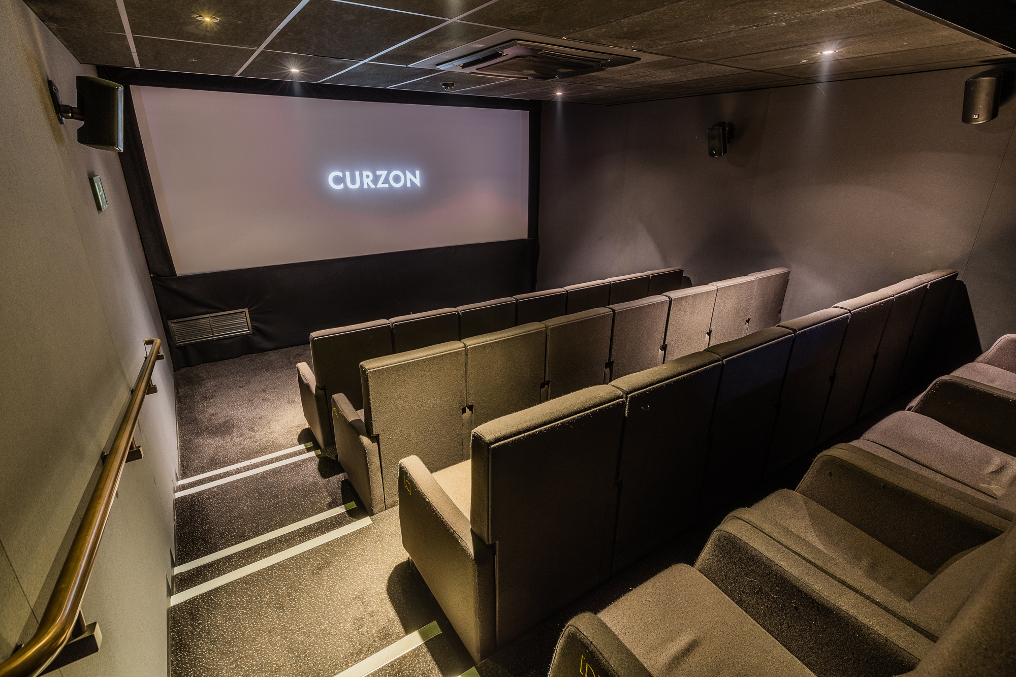 Sleek screening room with tiered seating for private events at Curzon Bloomsbury.