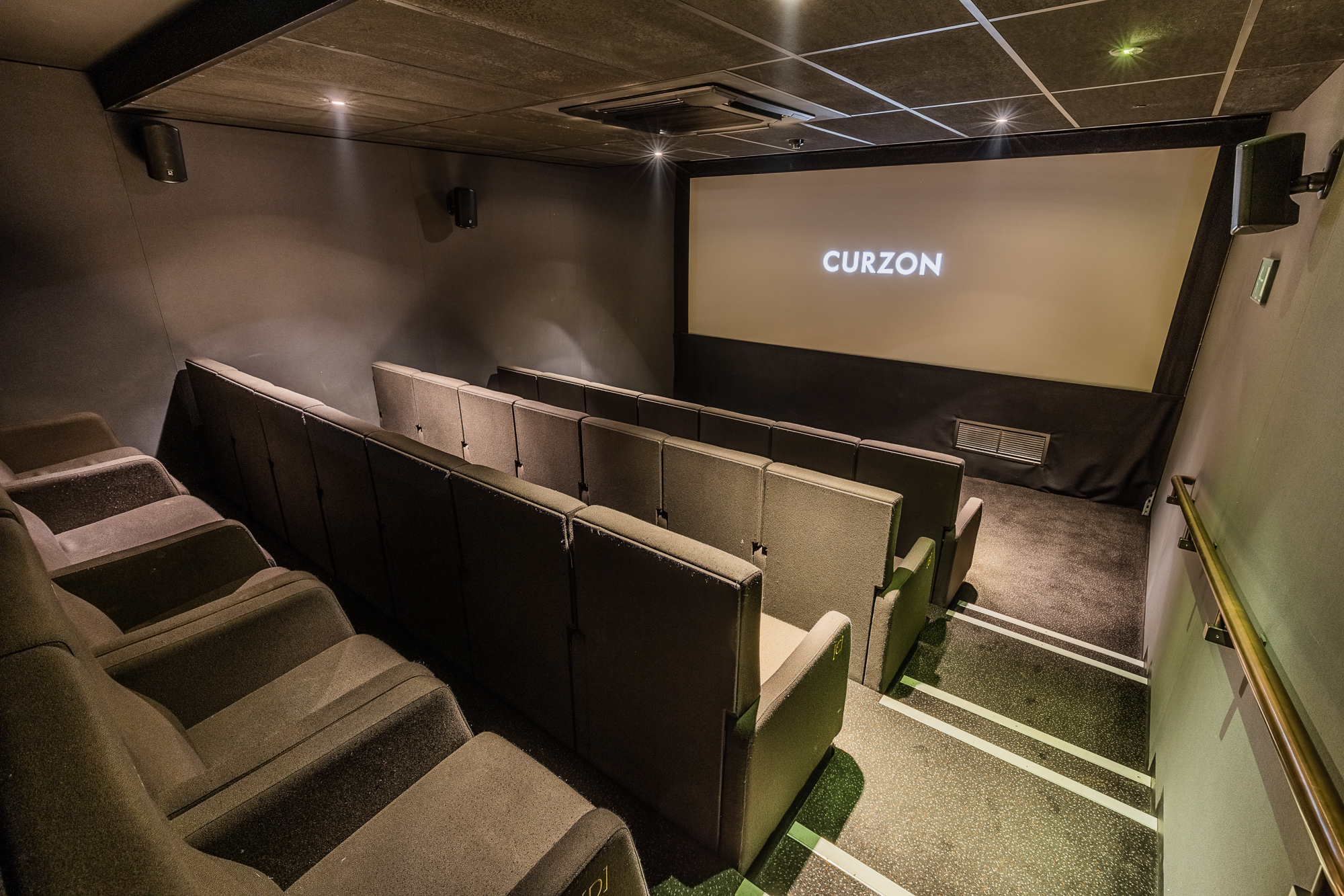 Intimate screening room with tiered seating for film screenings and corporate events.