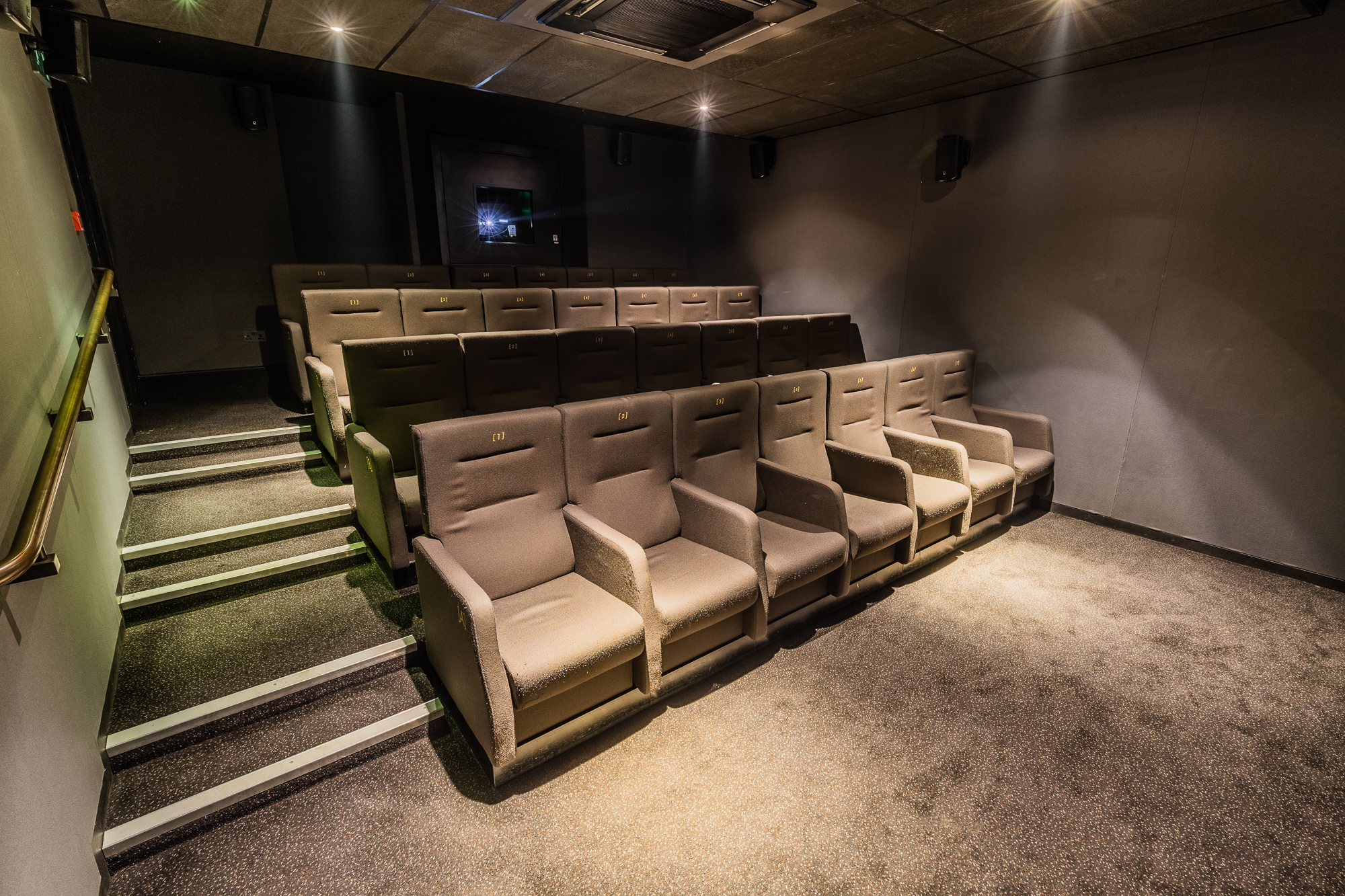 Modern screening room with plush seating for film screenings and corporate events.