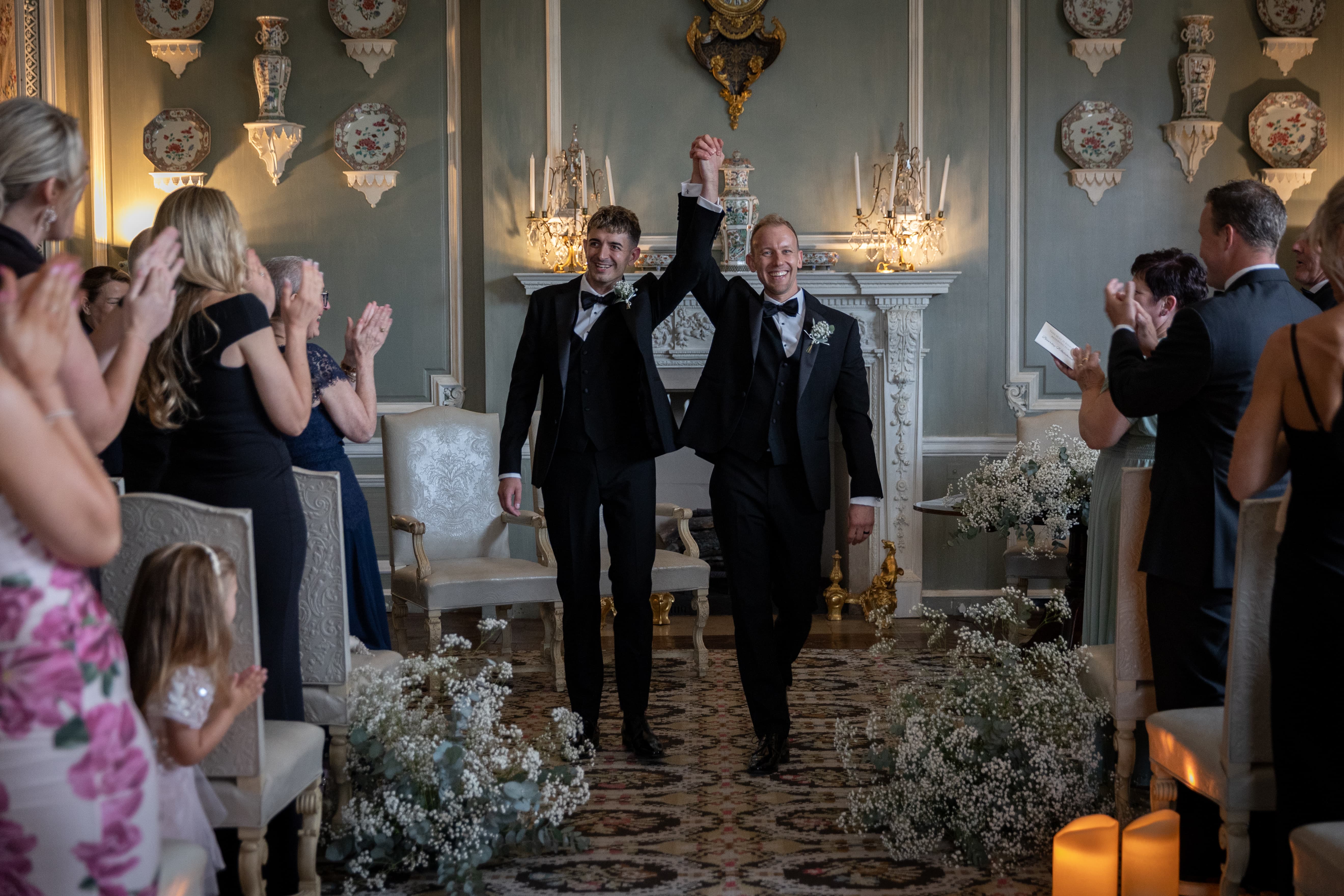 Wedding ceremony in Leeds Castle with elegant floral decor and formal attire.