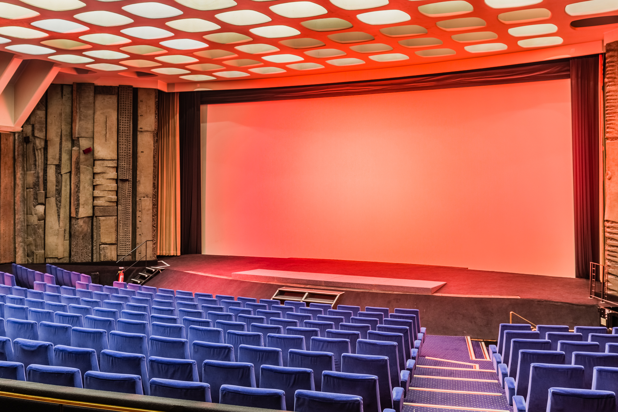Spacious Curzon Mayfair auditorium with blue seating, ideal for presentations and performances.