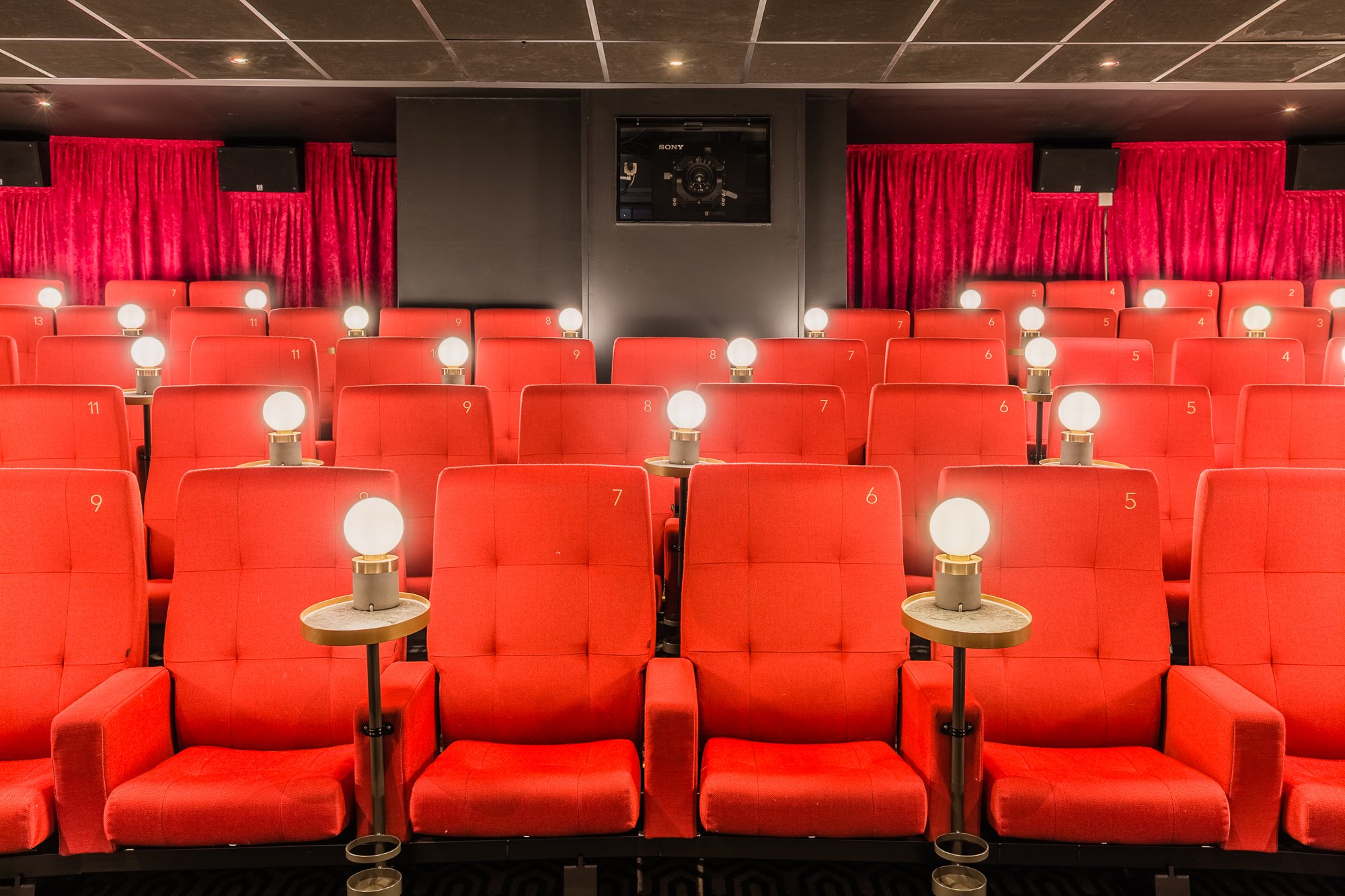 Stylish Curzon Mayfair theater with plush red seating, ideal for film screenings and events.