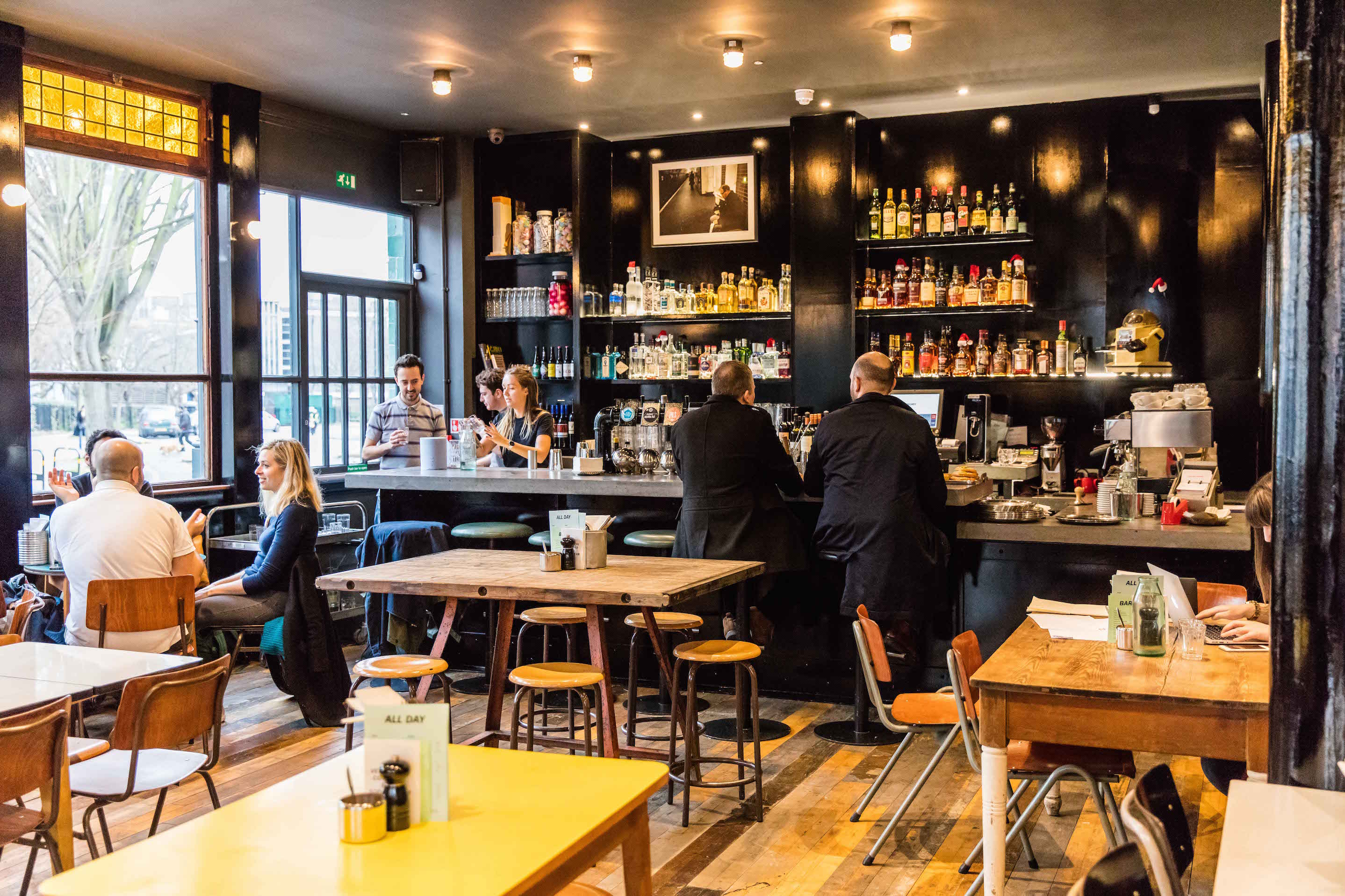 Vibrant café venue with warm lighting for networking and informal meetings.