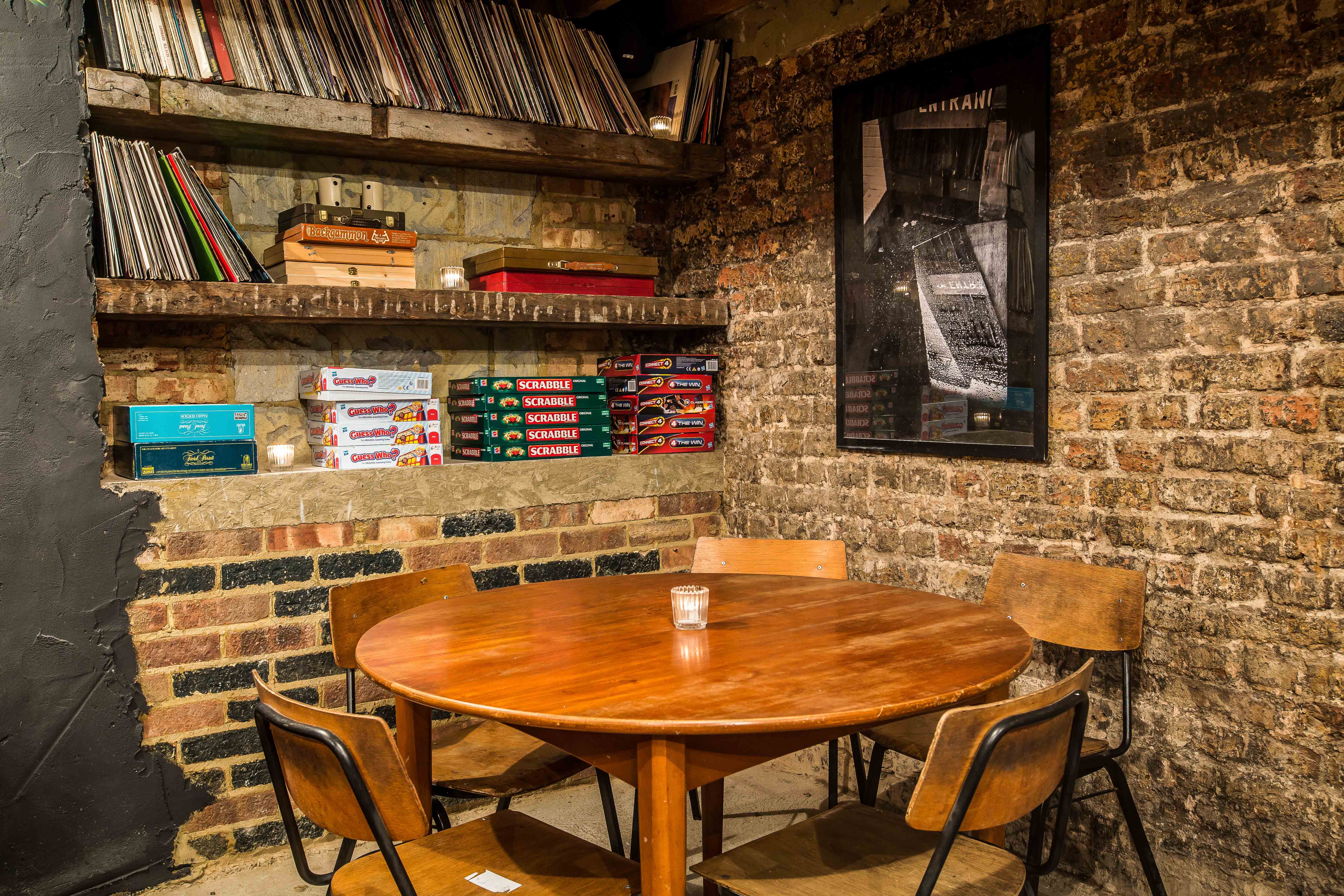 Cozy basement meeting space with round table, ideal for brainstorming sessions and team gatherings.