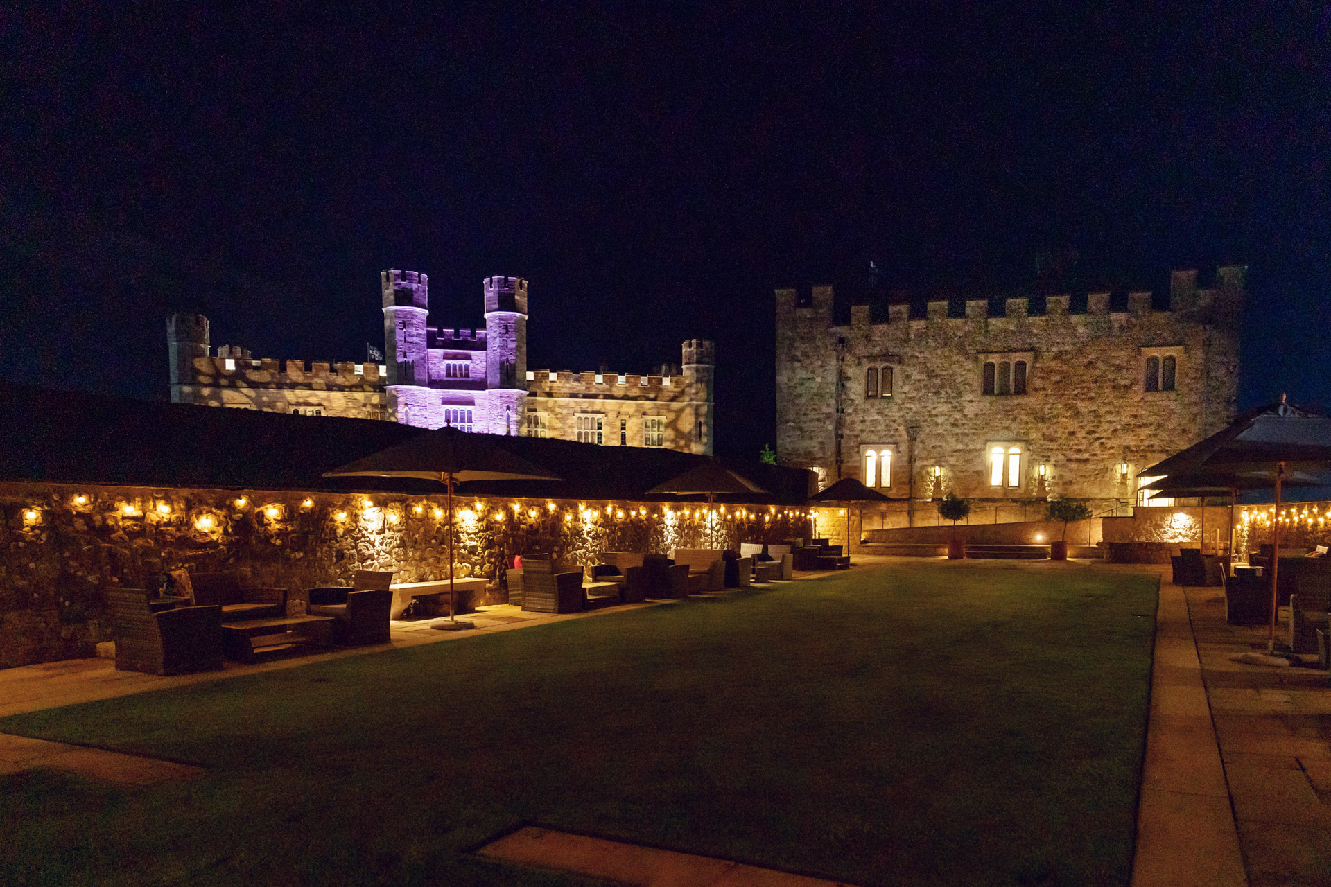 Maiden's Tower at Leeds Castle, illuminated venue for receptions and events.
