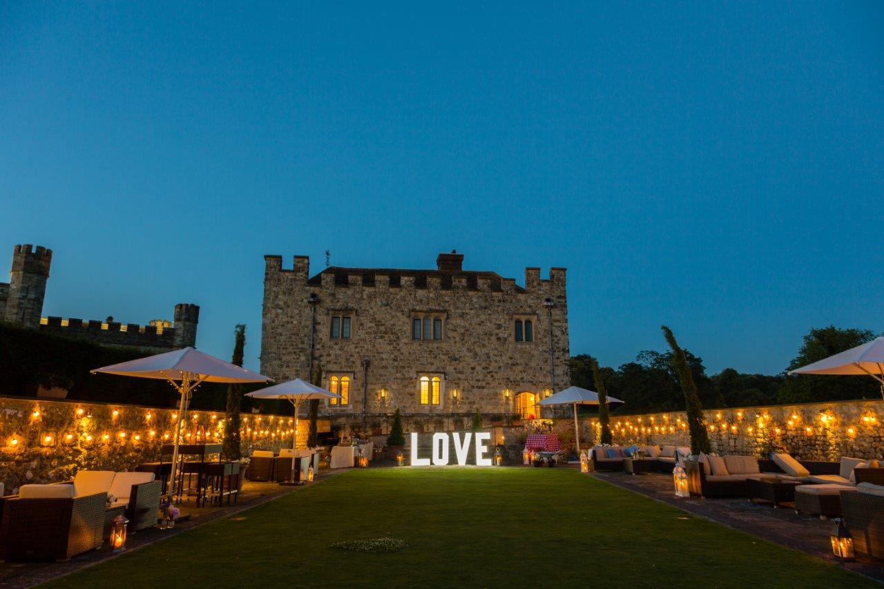 Maiden's Tower at Leeds Castle, illuminated venue for romantic weddings and events.