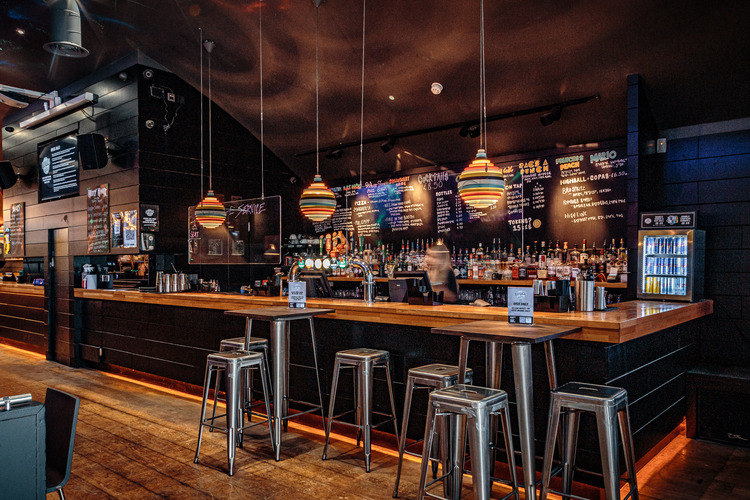 Modern bar venue with stylish decor for networking events and social gatherings.