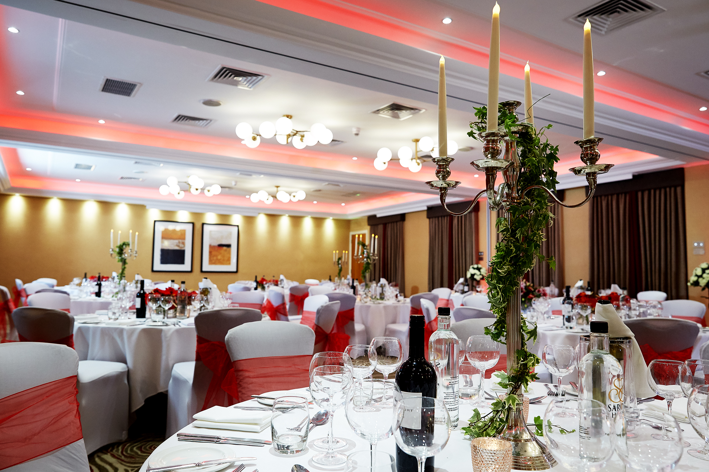 Elegant Kings Suite banquet room with white linens, perfect for weddings and corporate events.