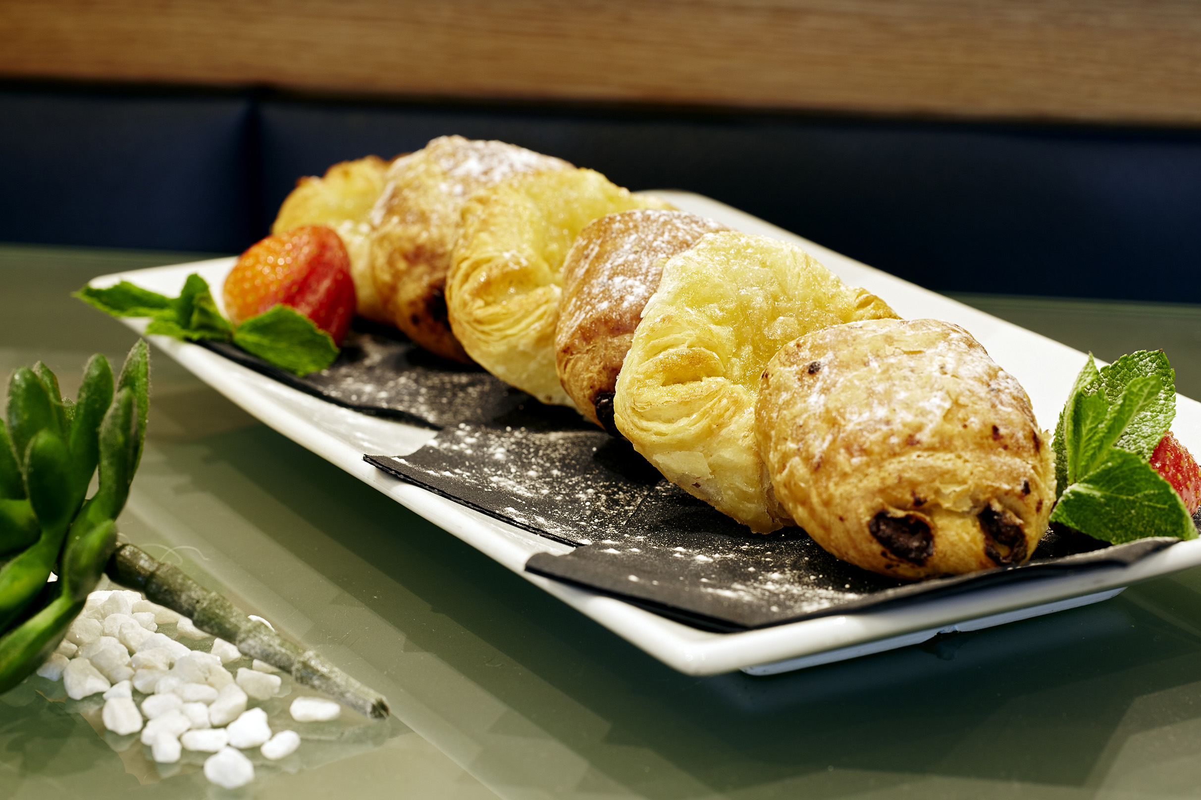 Elegant pastry platter with strawberries in Kings Suite, perfect for meetings and events.