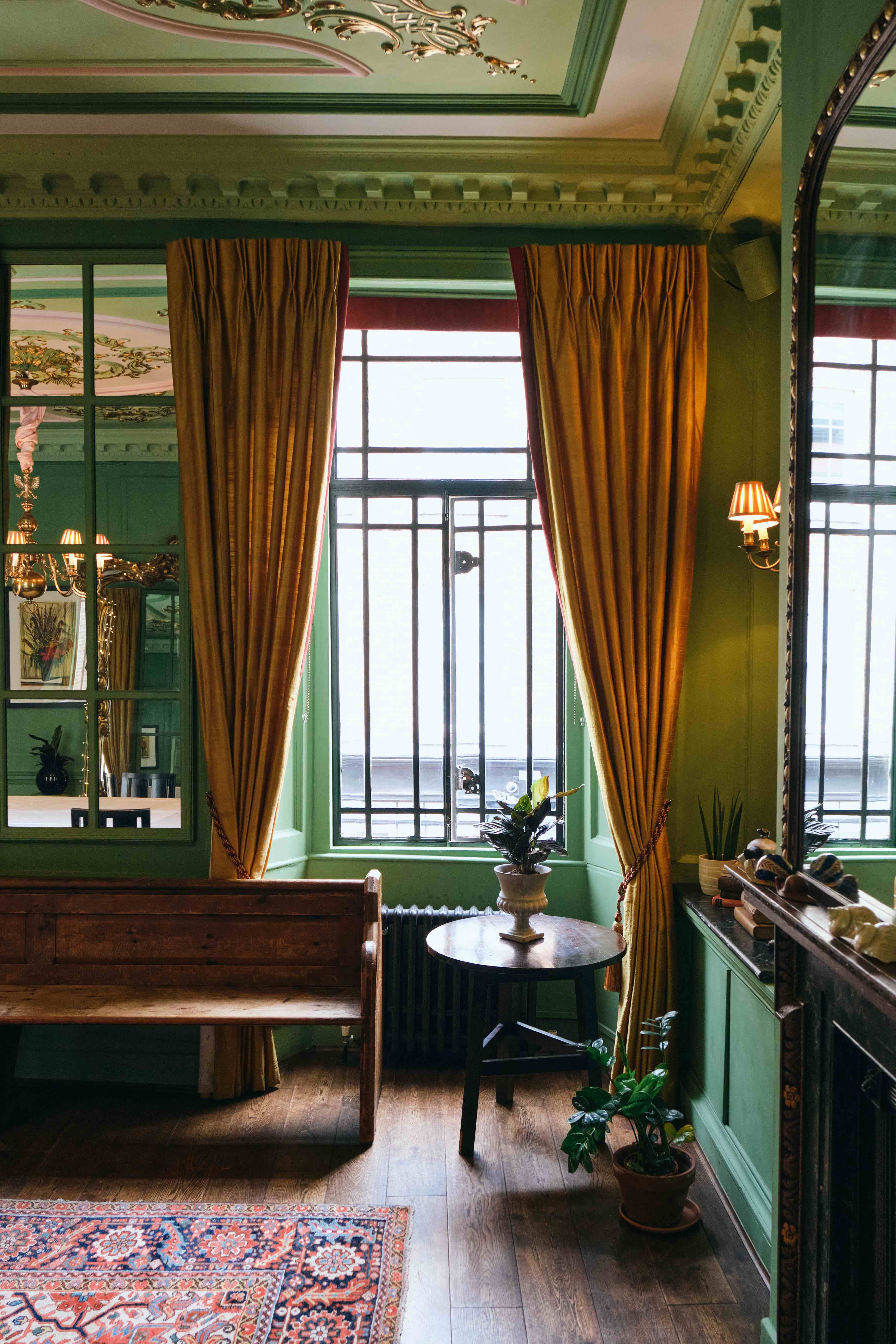 Le Salon Vert L'Escargot event venue green wall gold drapes