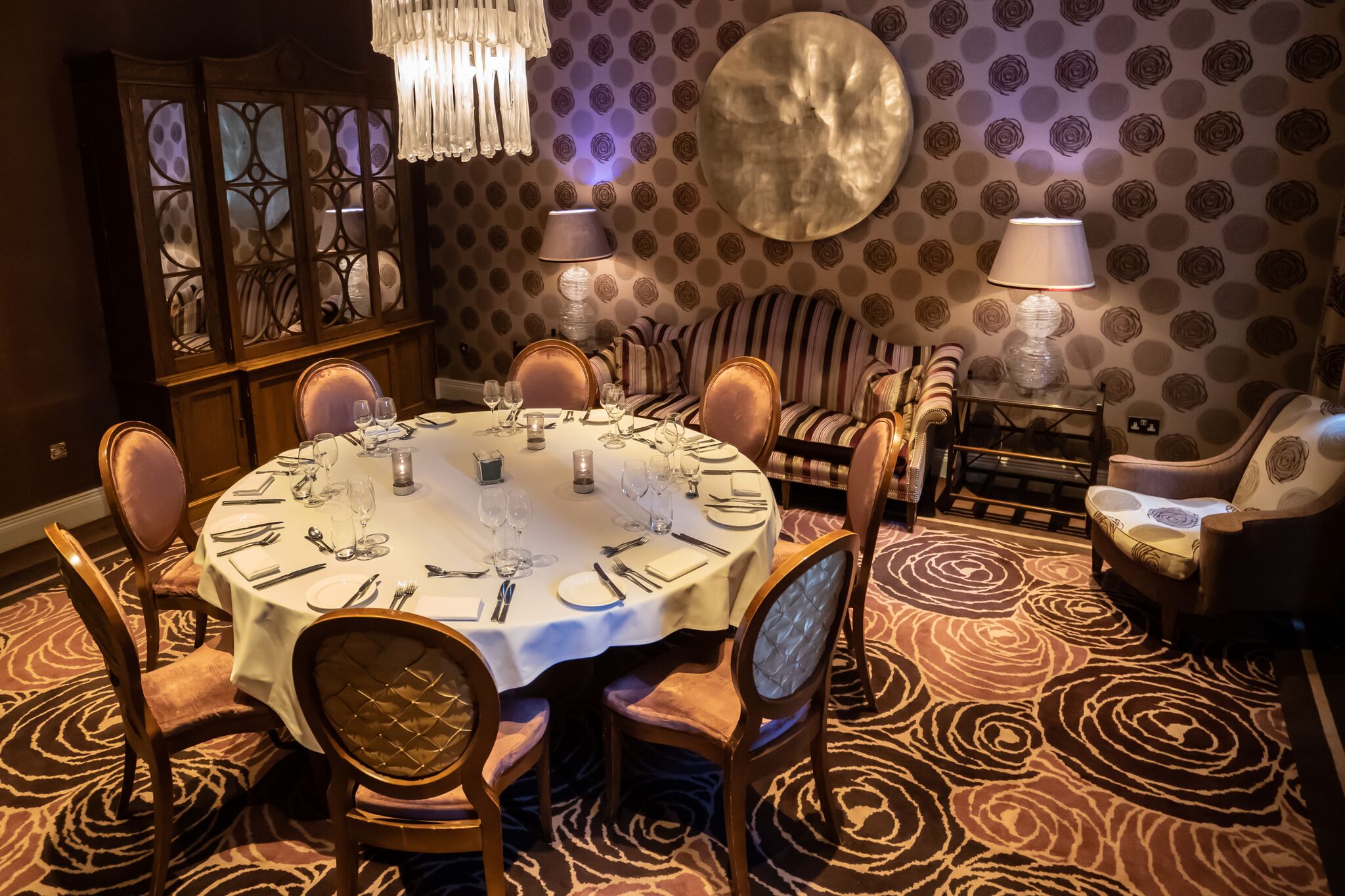 Elegant round table in The Roseate Library Room for intimate gatherings and events.