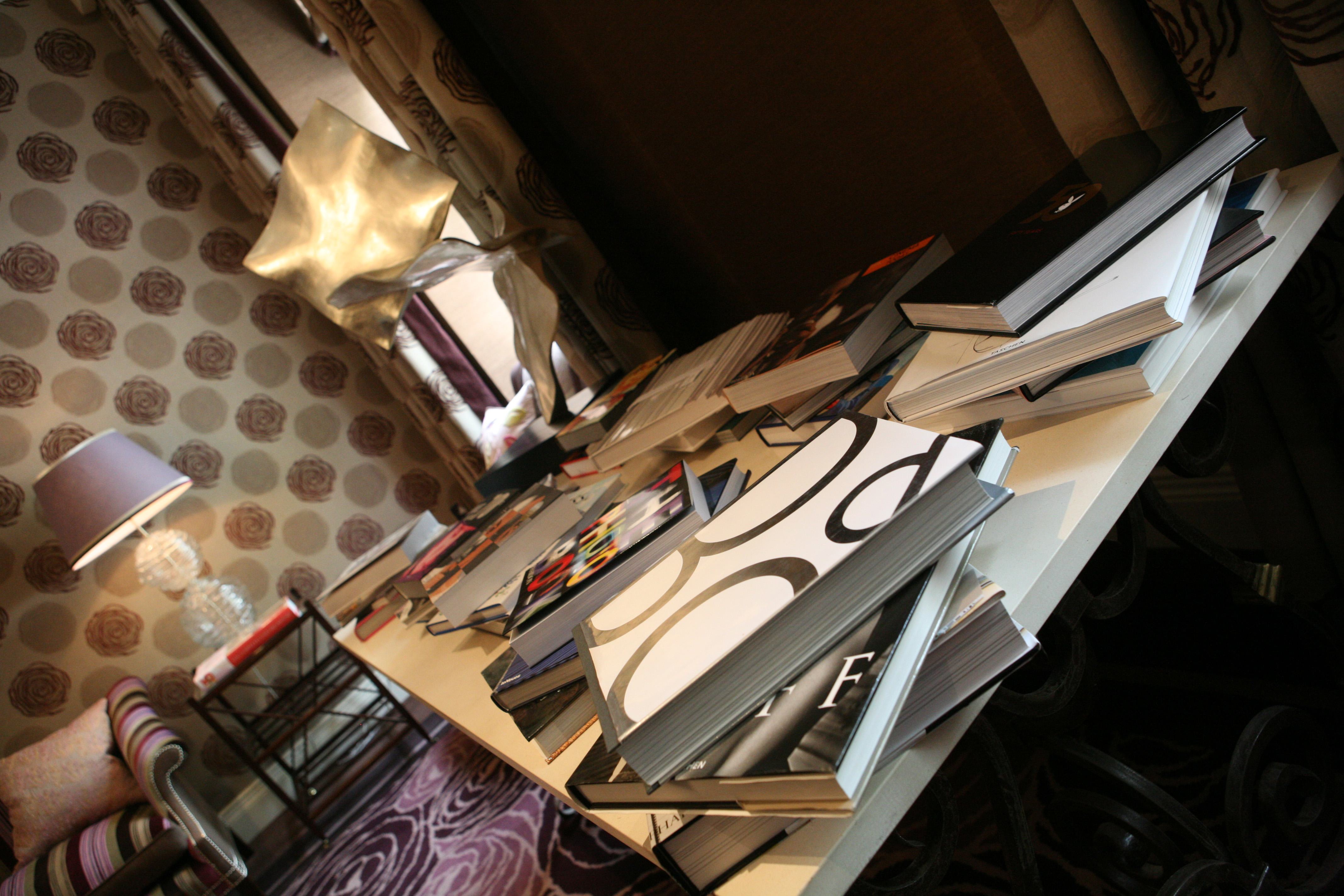Library Room at The Roseate, Reading: stylish table with books for creative meetings.