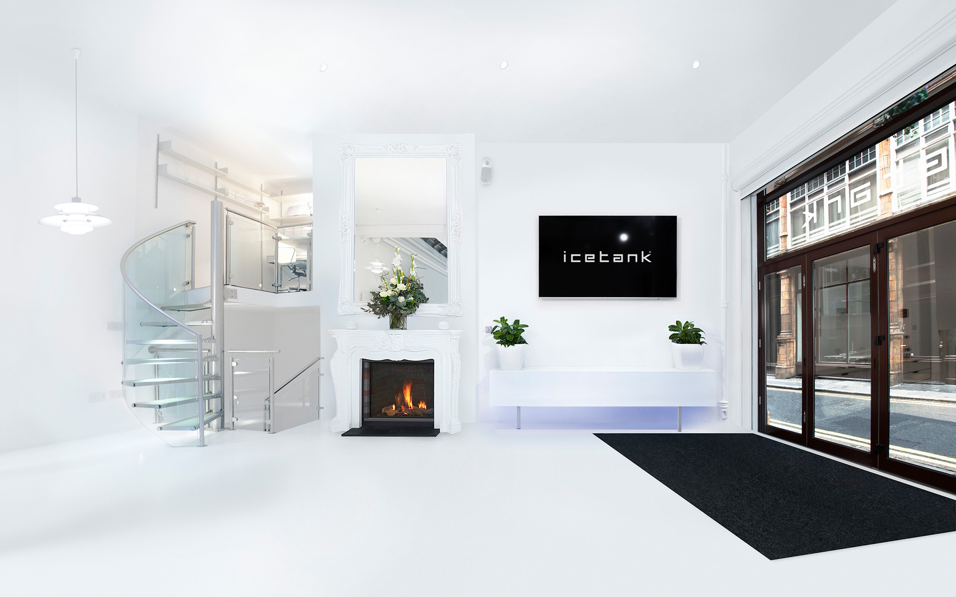 Modern event space with spiral staircase, ideal for corporate meetings and networking.