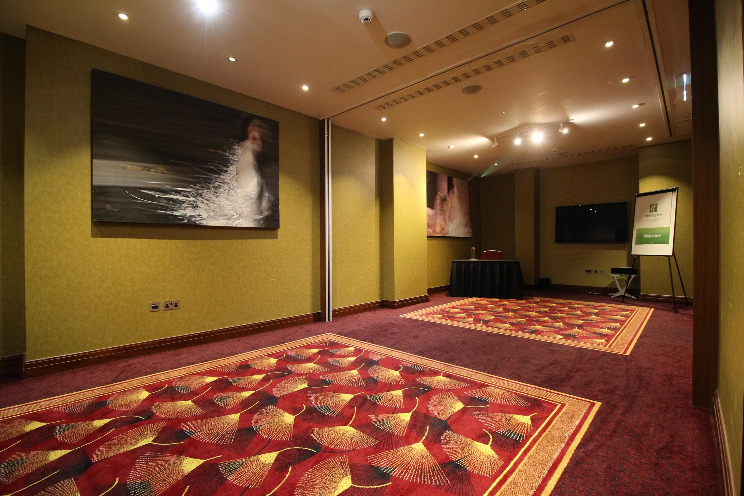 St James Suite at Holiday Inn Kensington - elegant meeting space for conferences and workshops.