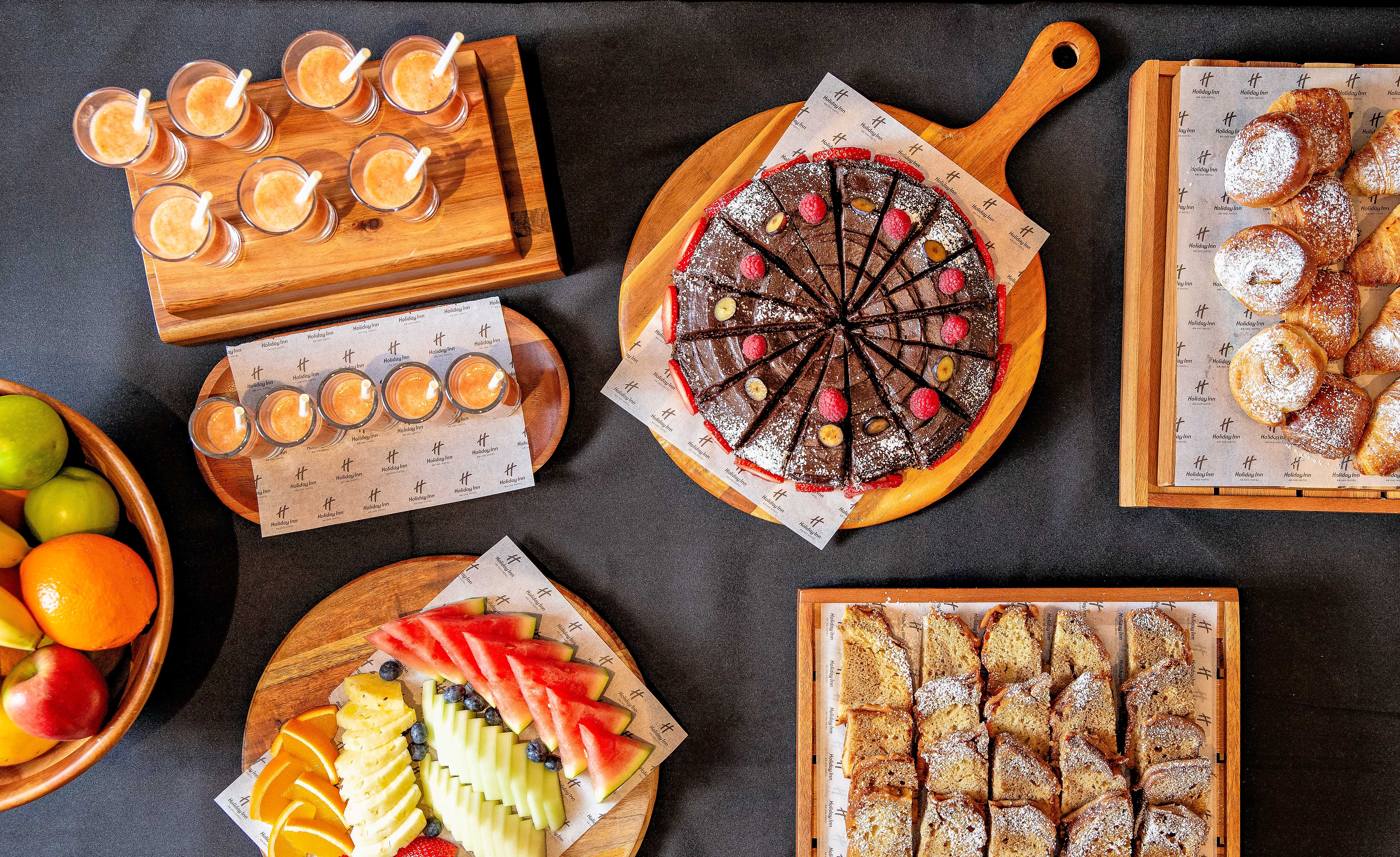 St James Suite at Holiday Inn Kensington with vibrant meeting break spread.