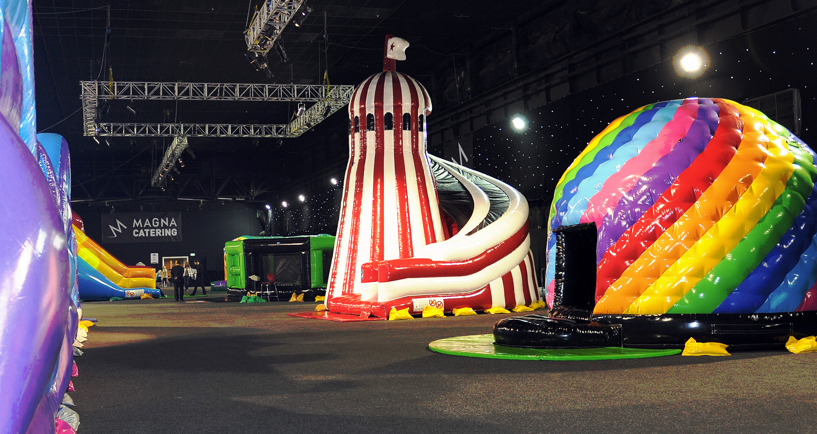 Vibrant event space with inflatable attractions for family-friendly festivals and corporate events.