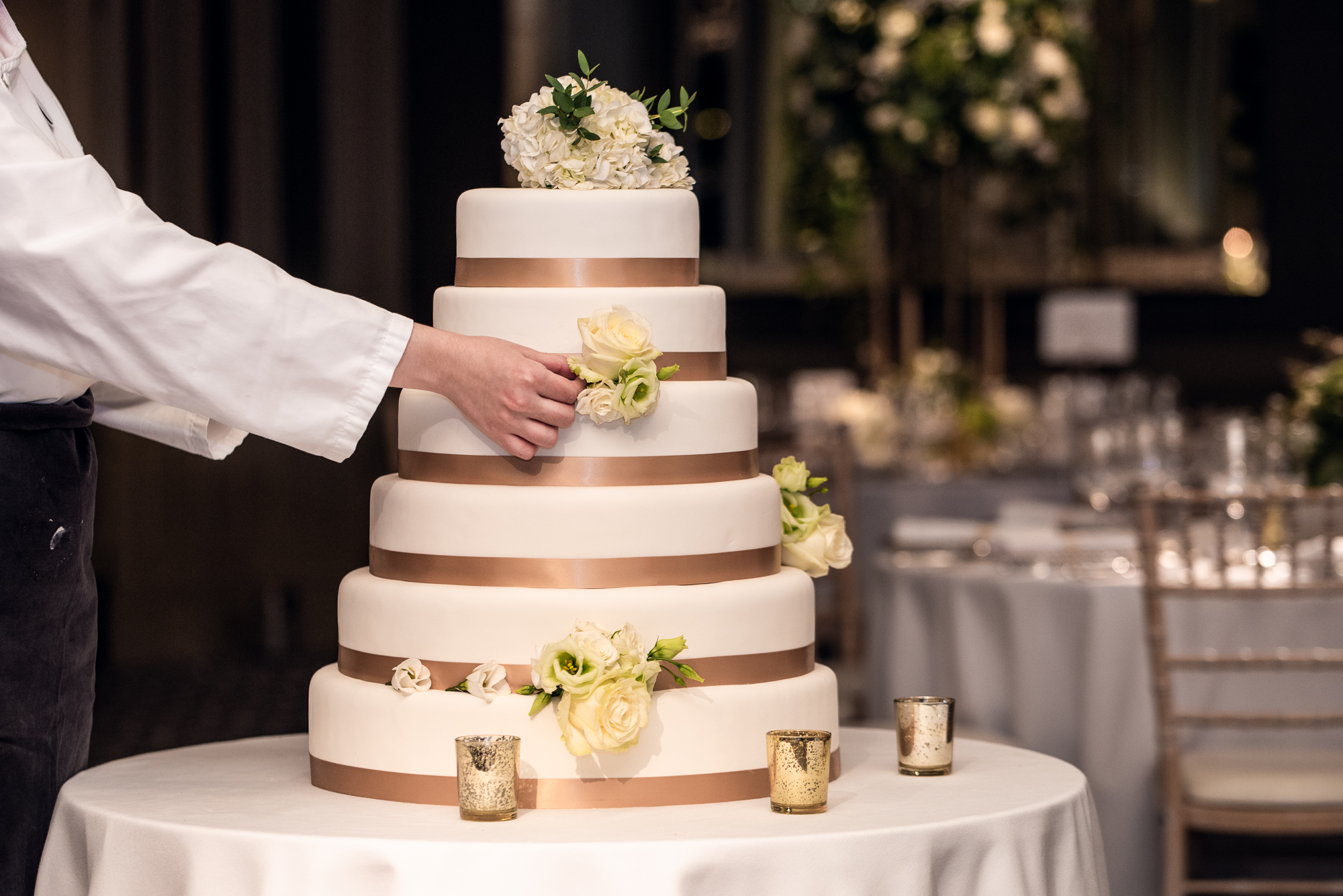 Wedding cake arrangement in Chartwell Ballroom, Hyatt Regency London - elegant decor.
