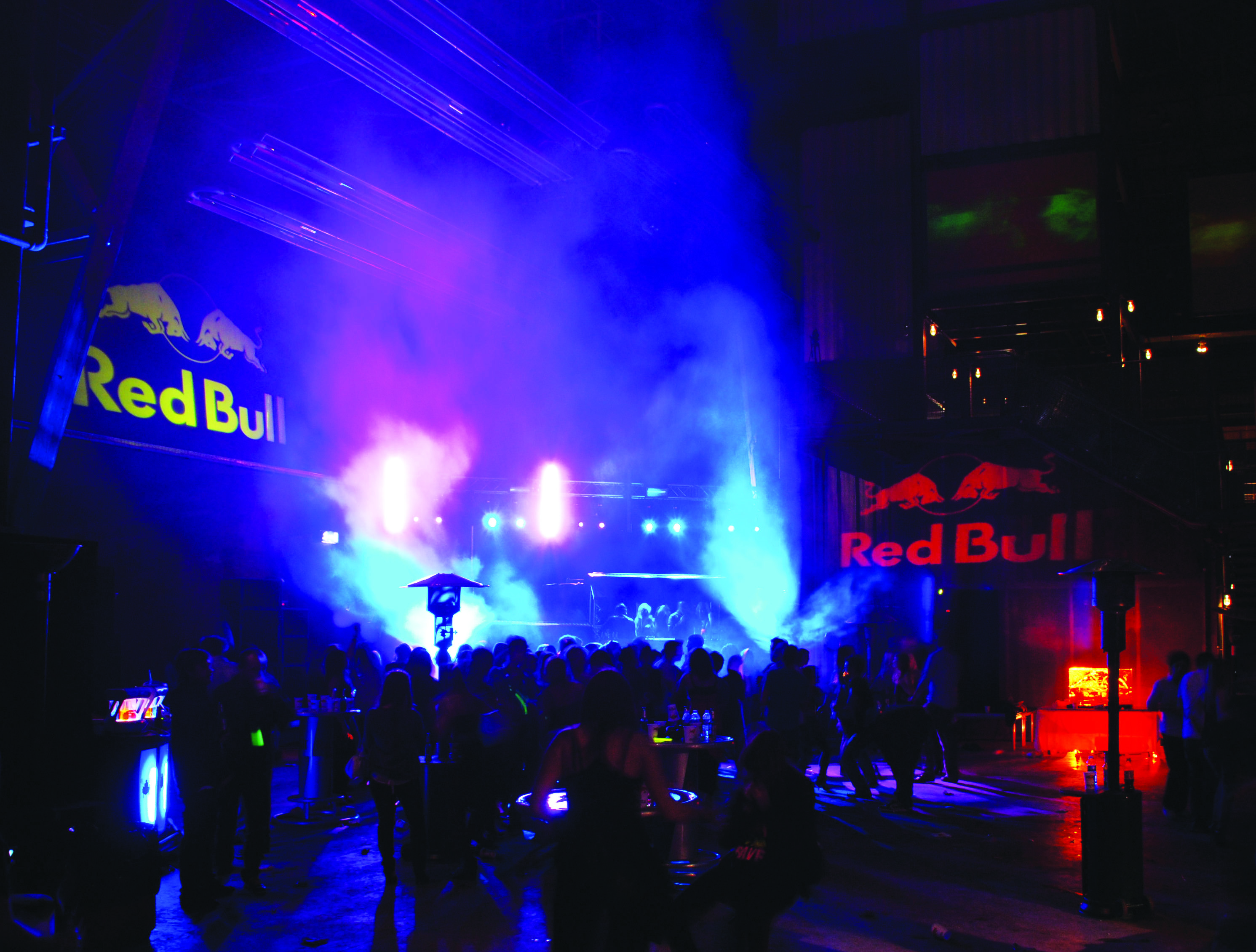 Vibrant MAGNA event space with Red Bull branding for dynamic brand activation.