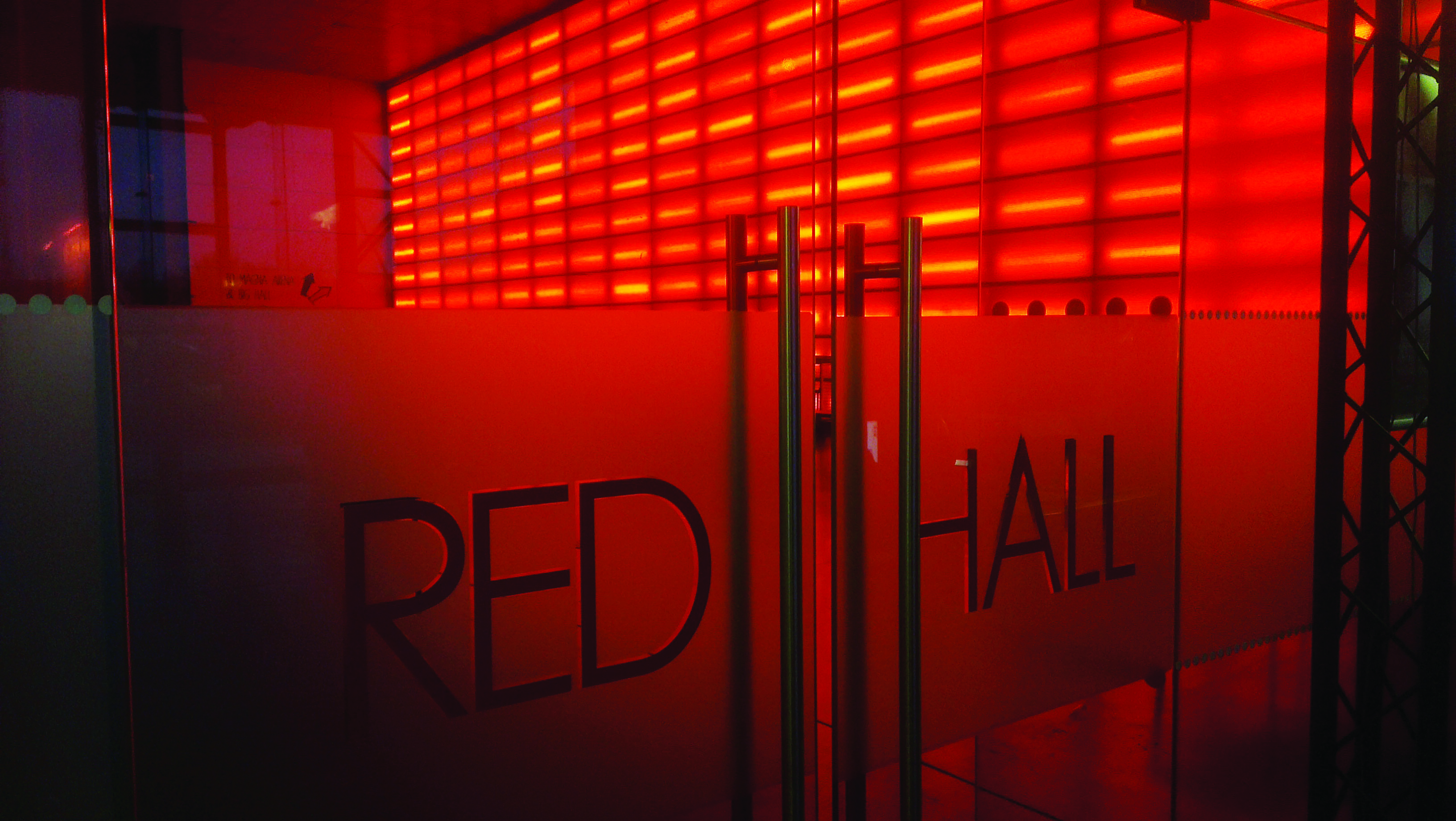 Red Hall at MAGNA: modern event space with striking red lighting for dynamic gatherings.