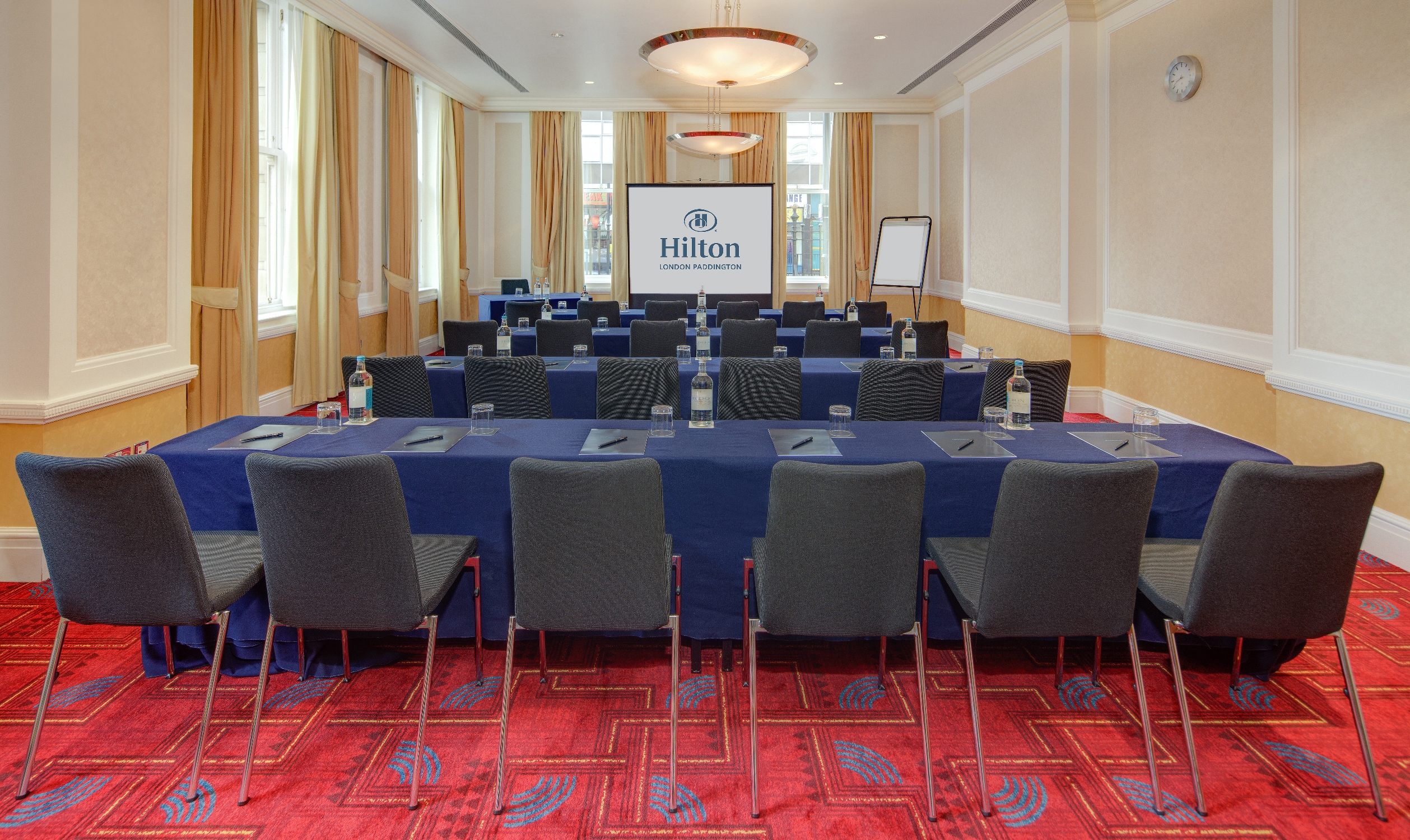 Meeting room with U-shaped seating for corporate events at Hilton London Paddington.