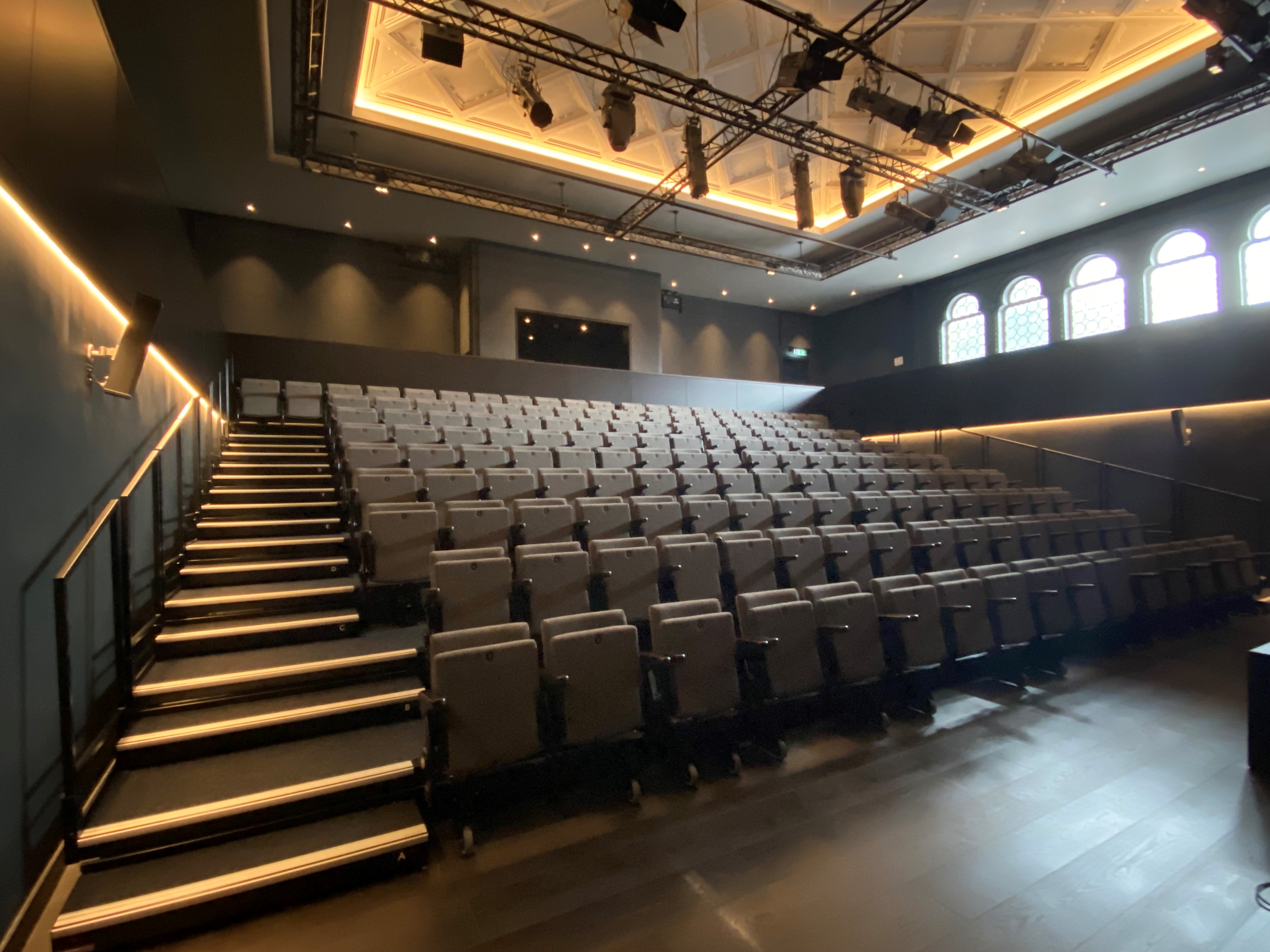 Brighton Dome Studio Theatre auditorium with tiered seating for conferences and presentations.
