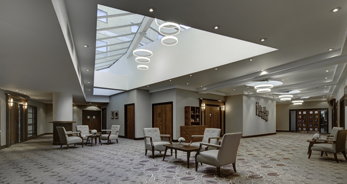 Isaac Newton suite at Hilton Cambridge, modern meeting space with skylight for events.