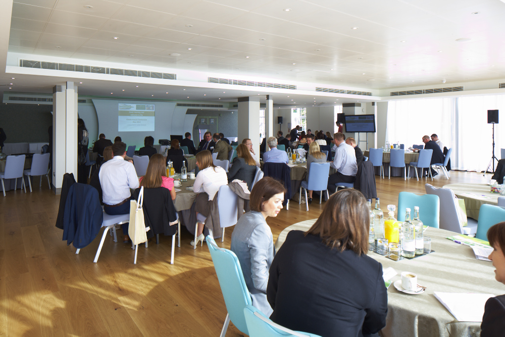 Thames View Suite conference with attendees, modern decor, networking and learning event.