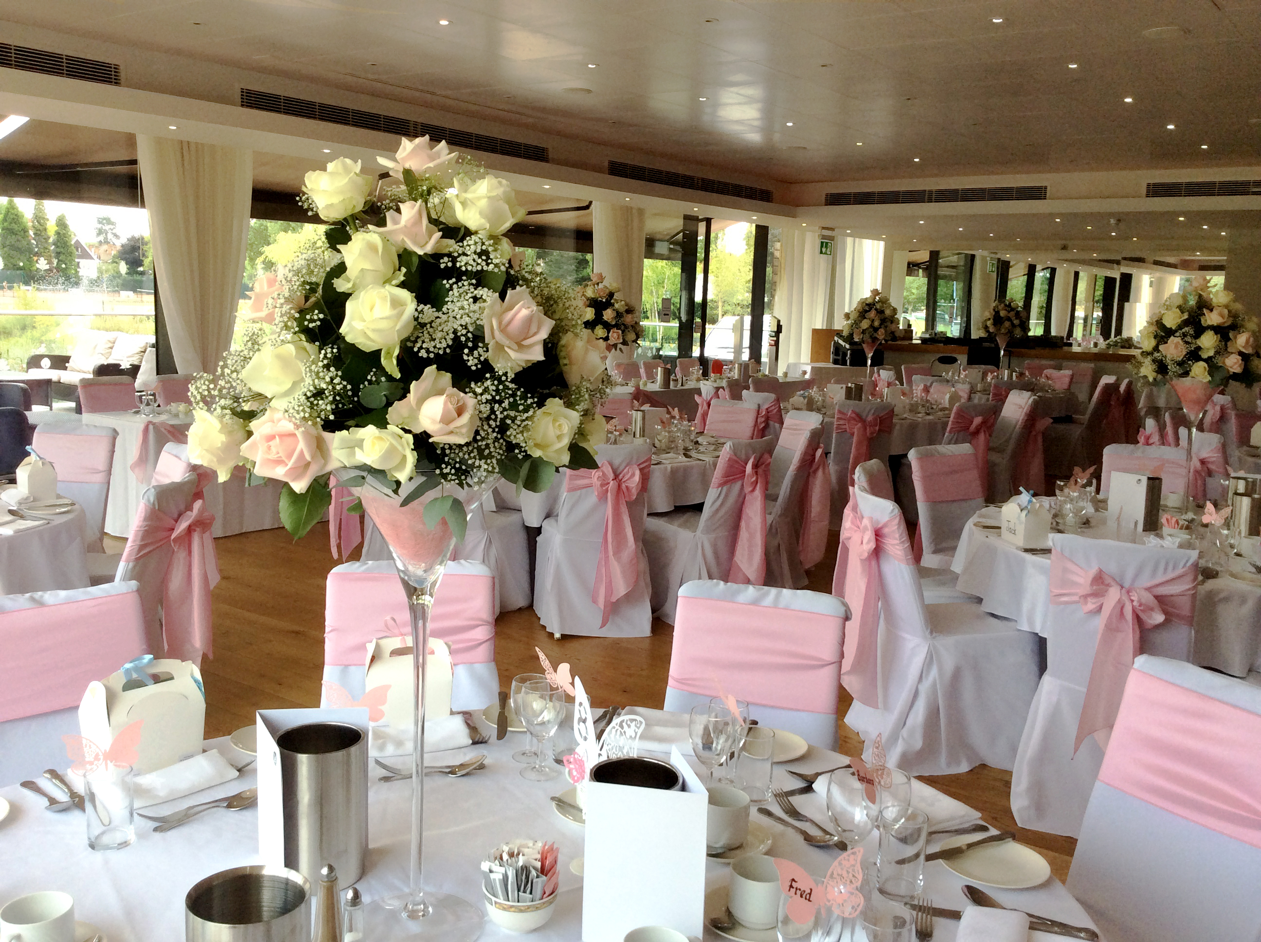 Thames View Suite at The Lensbury, elegant wedding venue with floral decor and natural light.