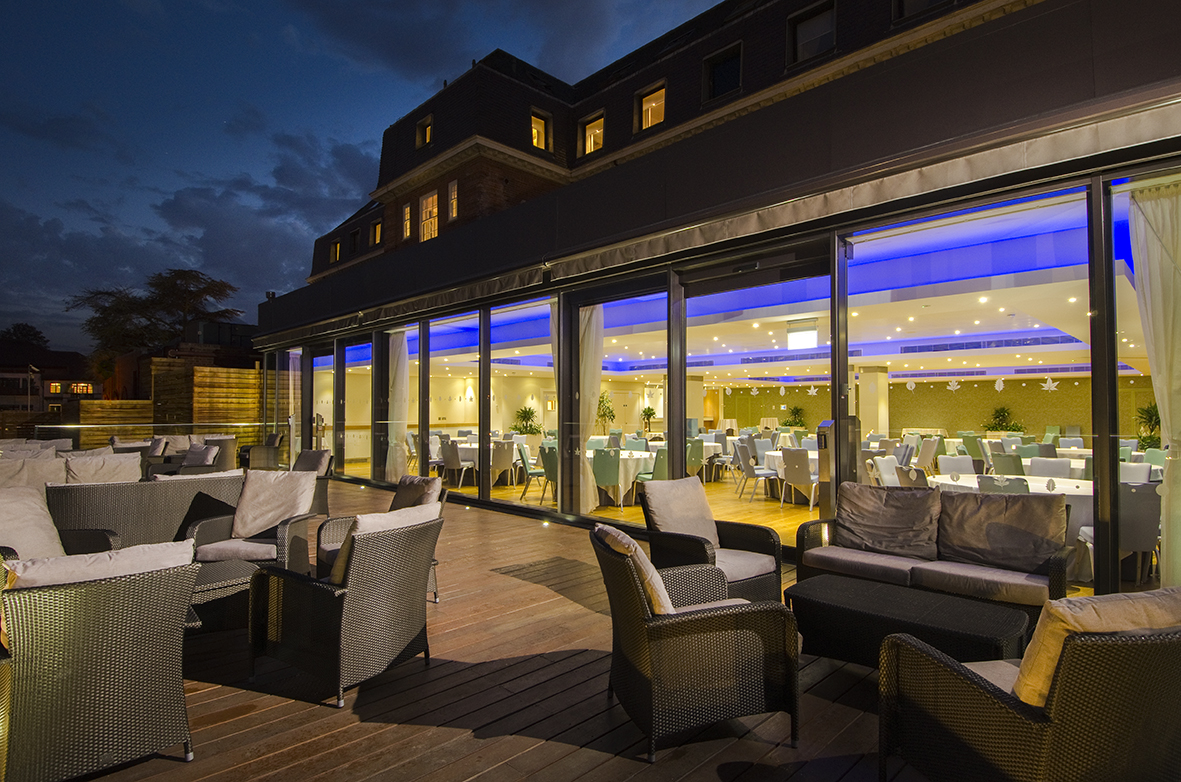 Thames View Suite outdoor lounge with modern furnishings for stylish evening events.