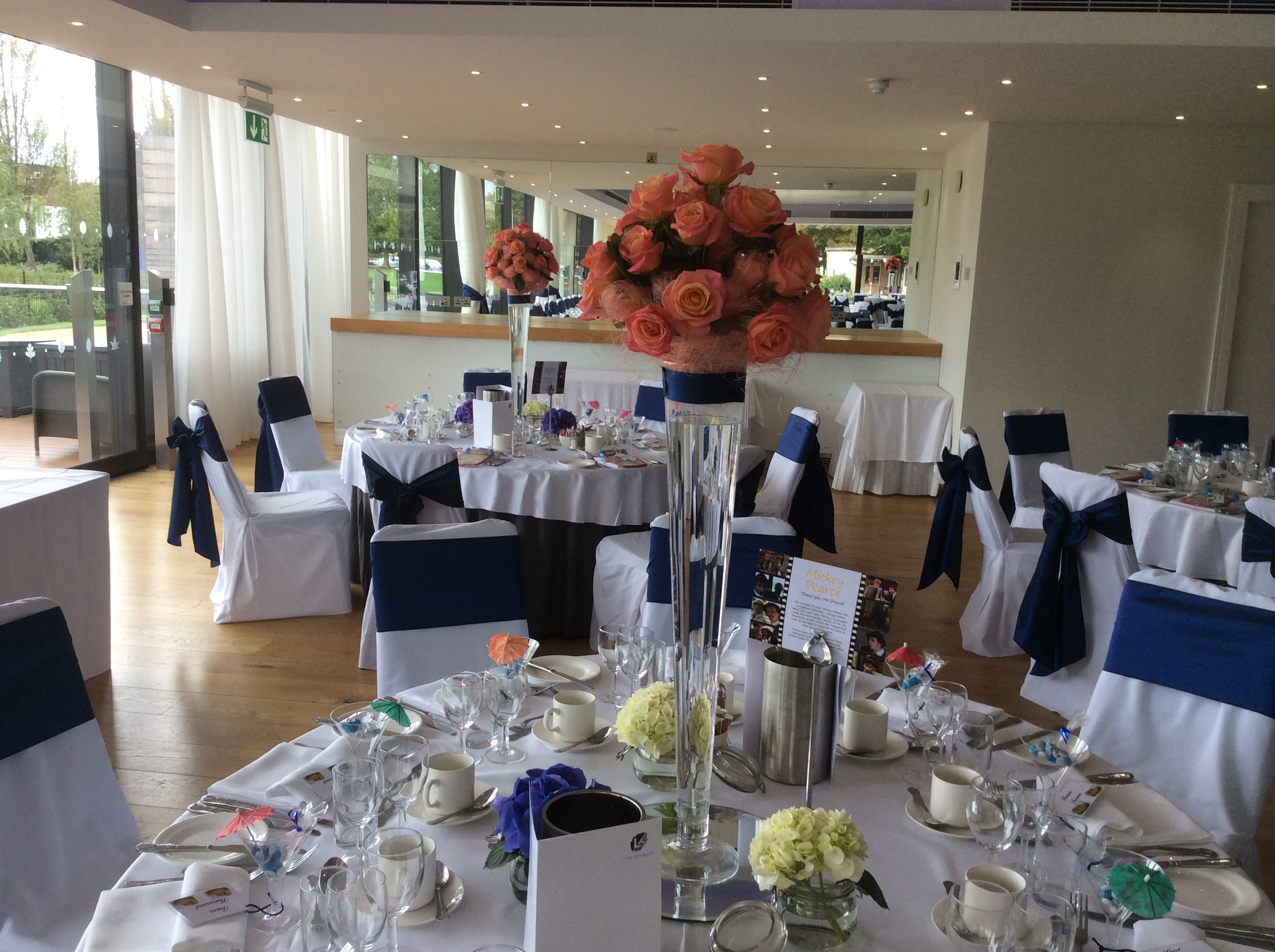 Thames View Suite event space with elegant tables, floral centerpieces for gatherings.