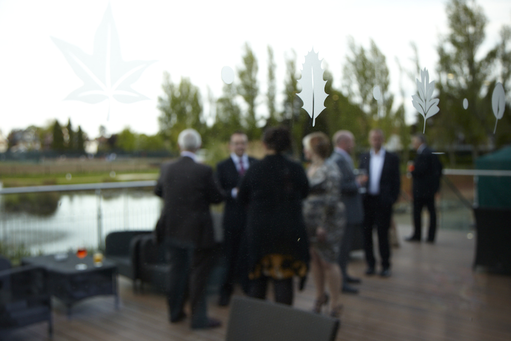 Thames View Suite outdoor networking event with elegant glass decor and scenic backdrop.