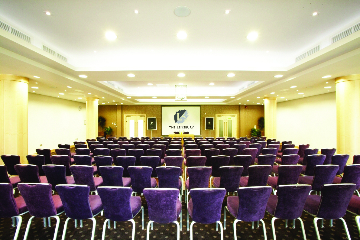 Wimbledon Room at The Lensbury: modern conference space with plush purple chairs for seminars.