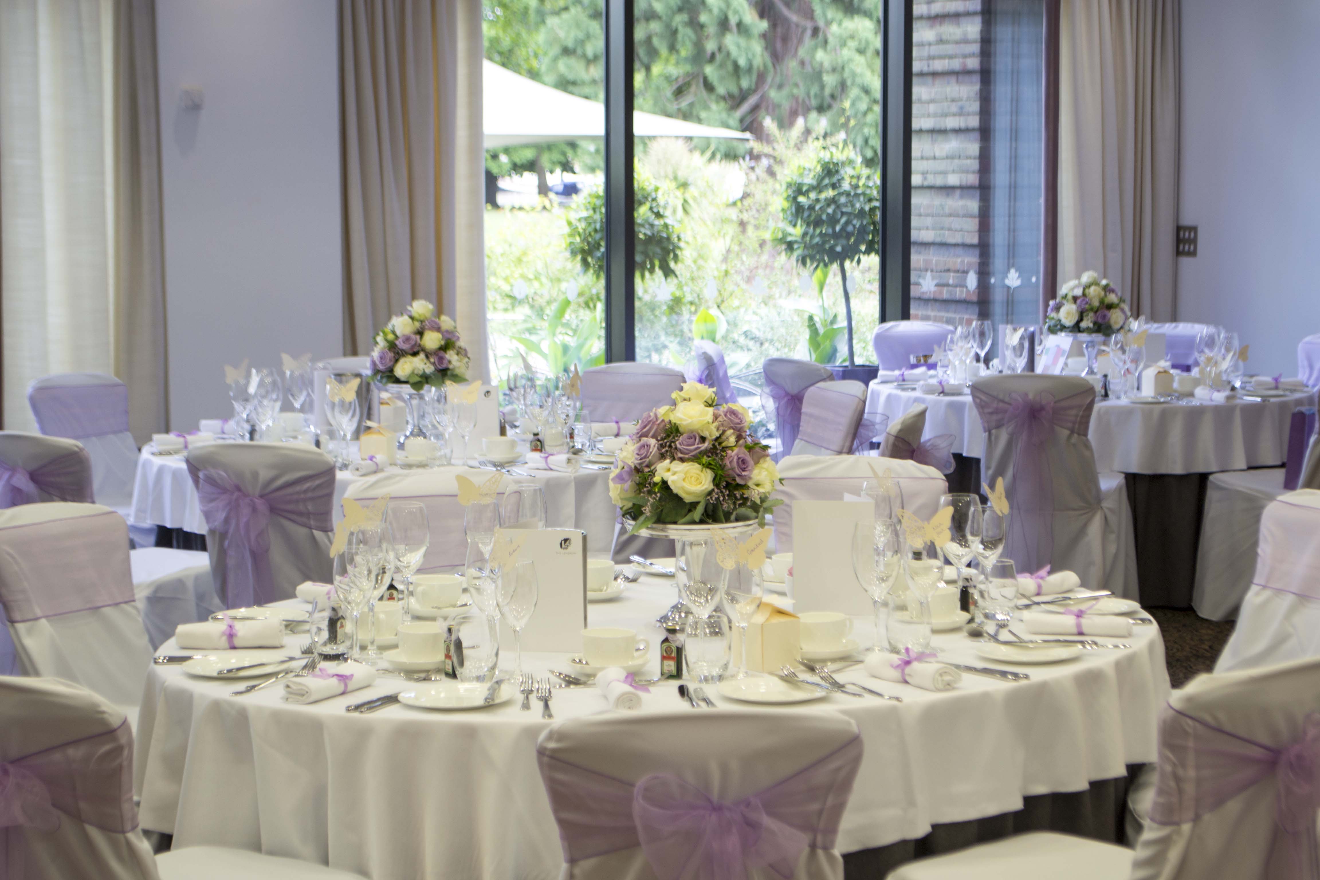 Elegant Wimbledon Room banquet setup with lavender accents for weddings and events.